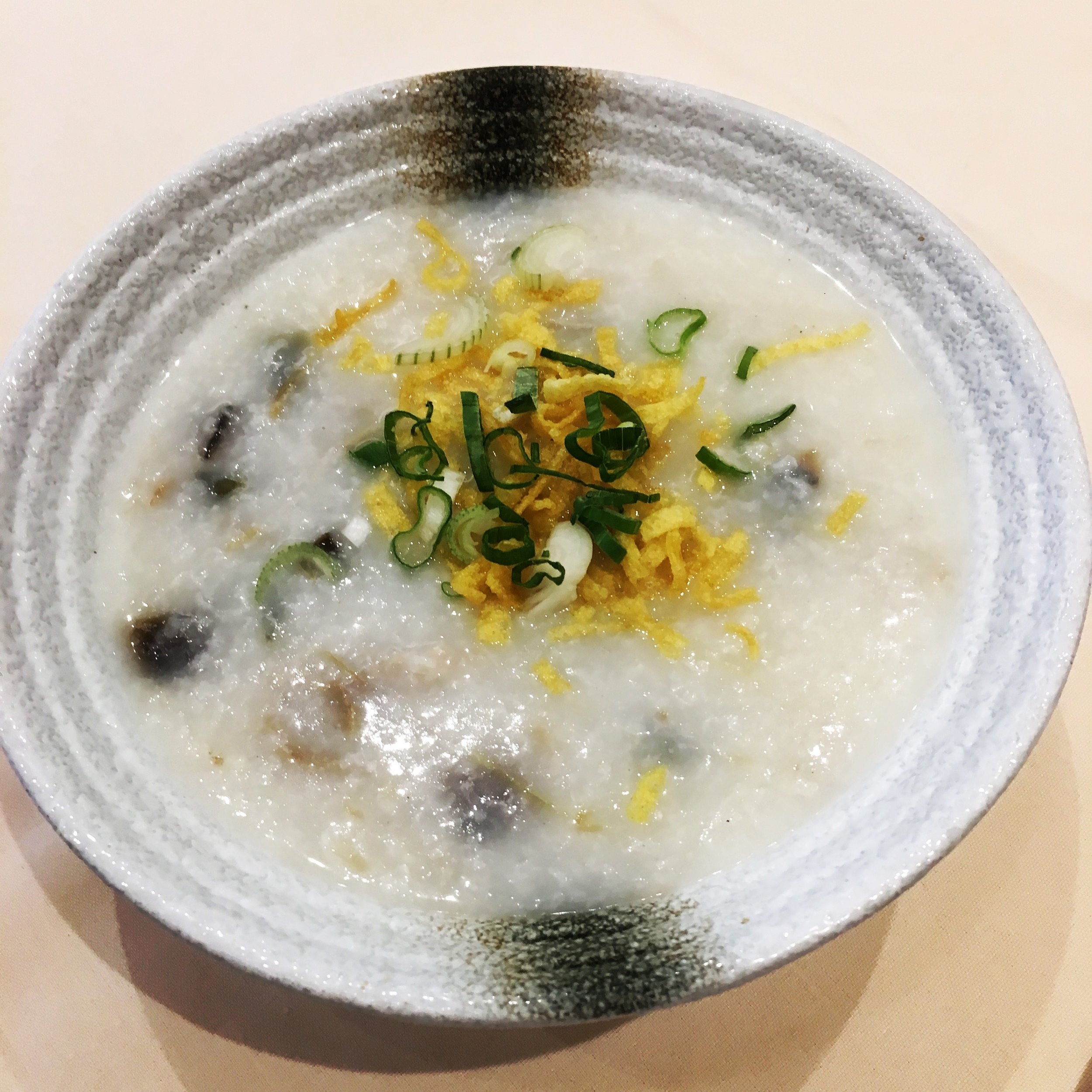 Congee with pork, thousand year egg and salted egg 