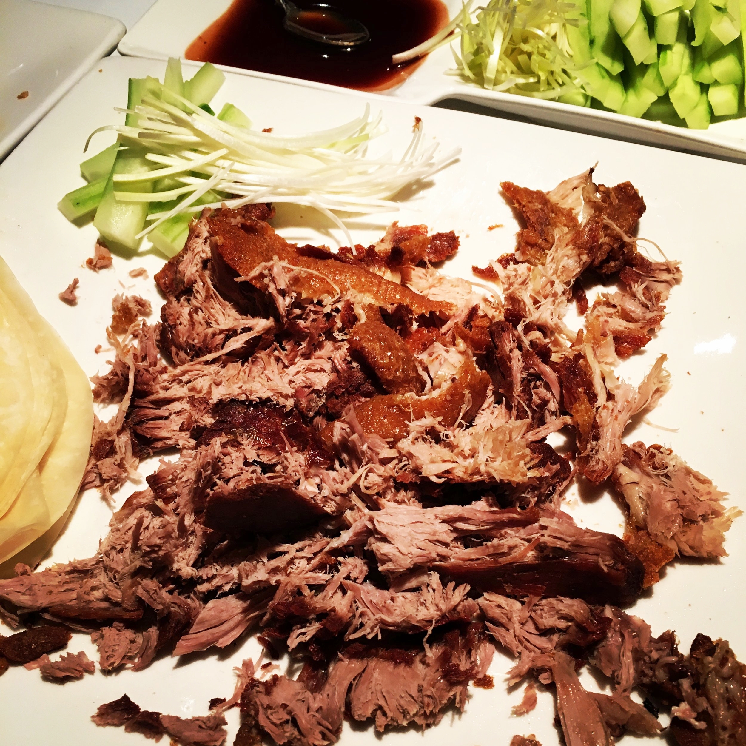 Crispy duck with pancakes, plum sauce and other condiments