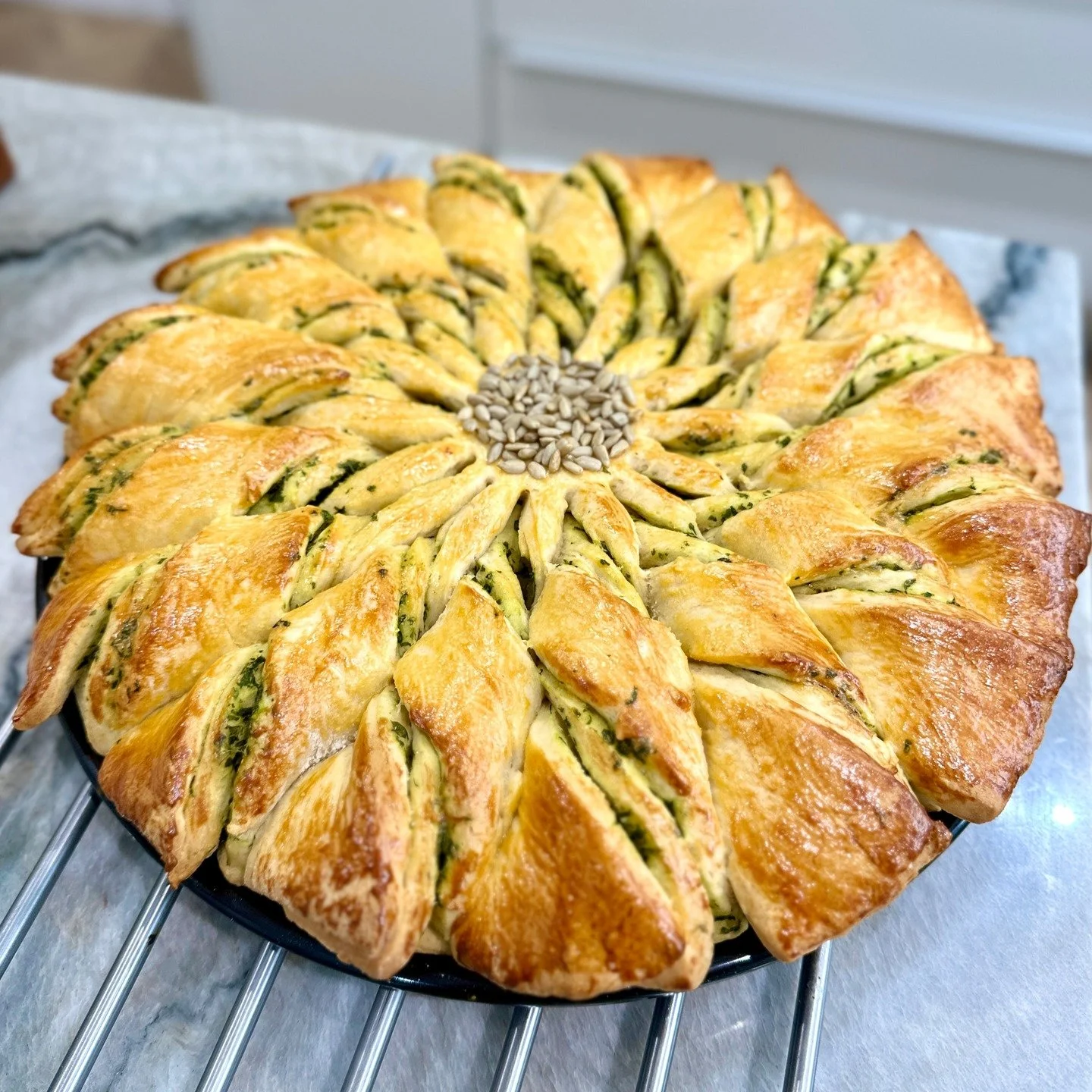 My challah with pesto for our weekend lunch with friends to go with a tomato soup with basil pur&eacute;e. 

#lovebakingandcooking #homemadechallah #challahbraiding #yippielovesfood #ukfoodie #igfoodie #asianfoodie #igfoods #ukfoodie #sharingwithfrie