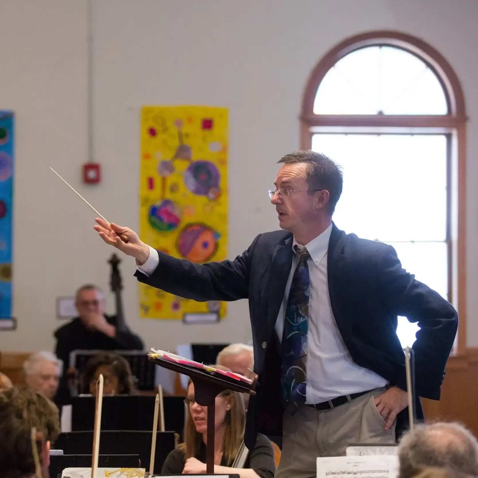 Chuck Taft, conducting during a performance at Givens Estate.