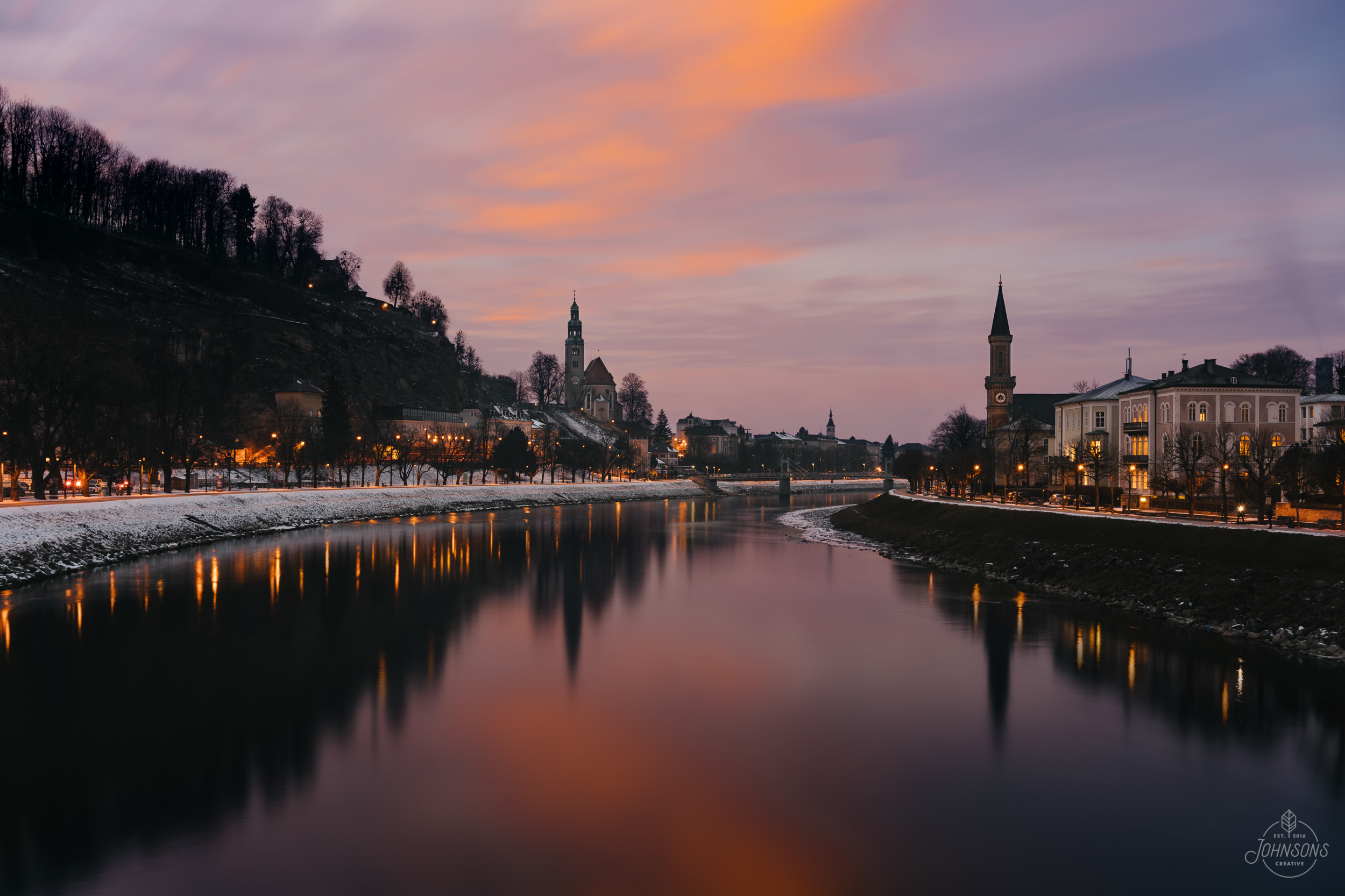  Sony a7rii |&nbsp;35mm 2.8 |&nbsp;f11 |&nbsp;8 sec |&nbsp;ISO 100 | Streetlights composited in to sunset photograph  The Salzach runs right through the Old Town, and there are several pedestrian only bridges that cross. This is looking NW from the M