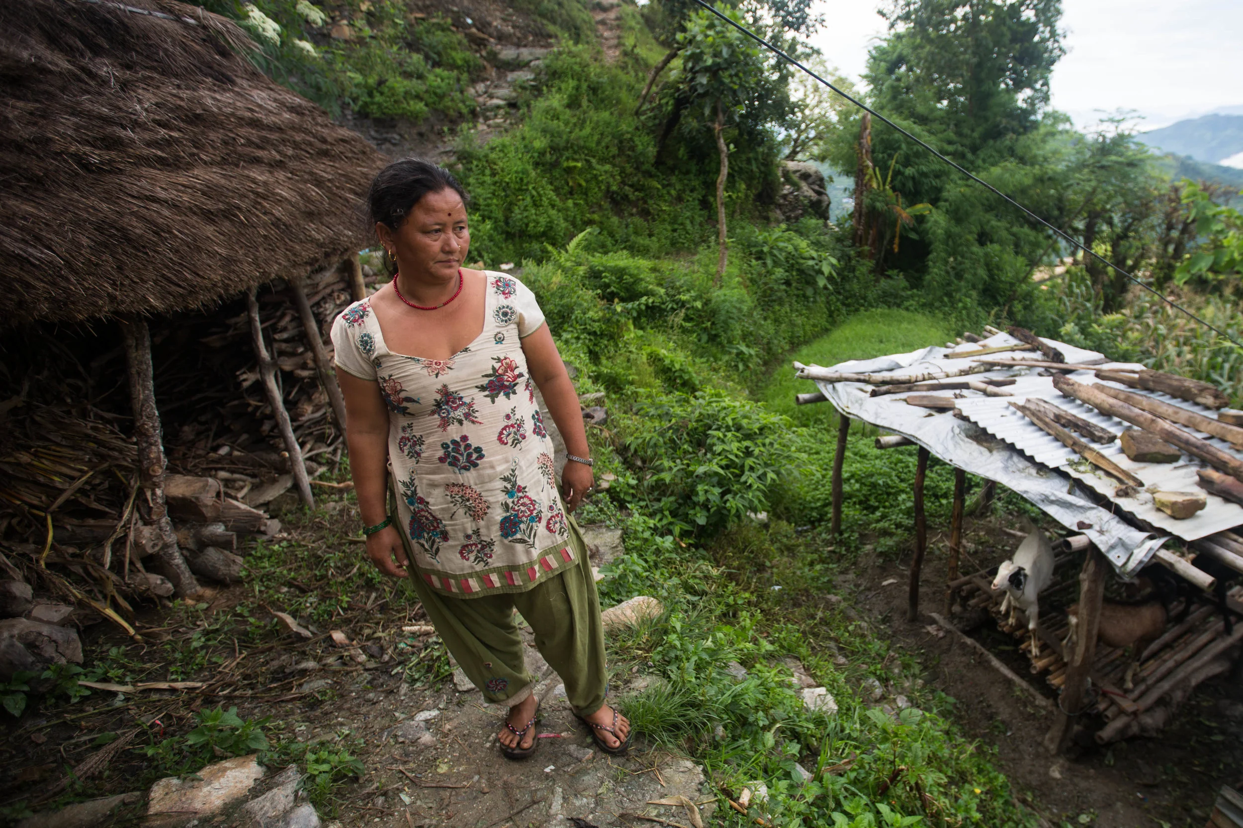 Chari Baram stands outside her home in Gorkha, Nepal, on Aug. 1, 2016.