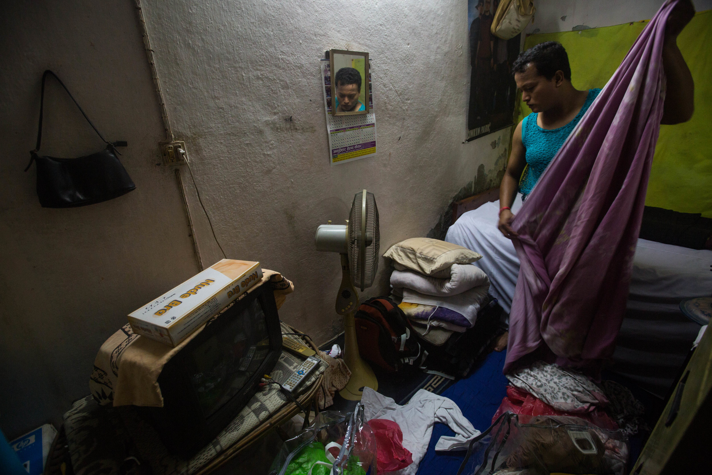 Sweety in her apartment in Kathmandu, which she rents to entertain clients for sex work.