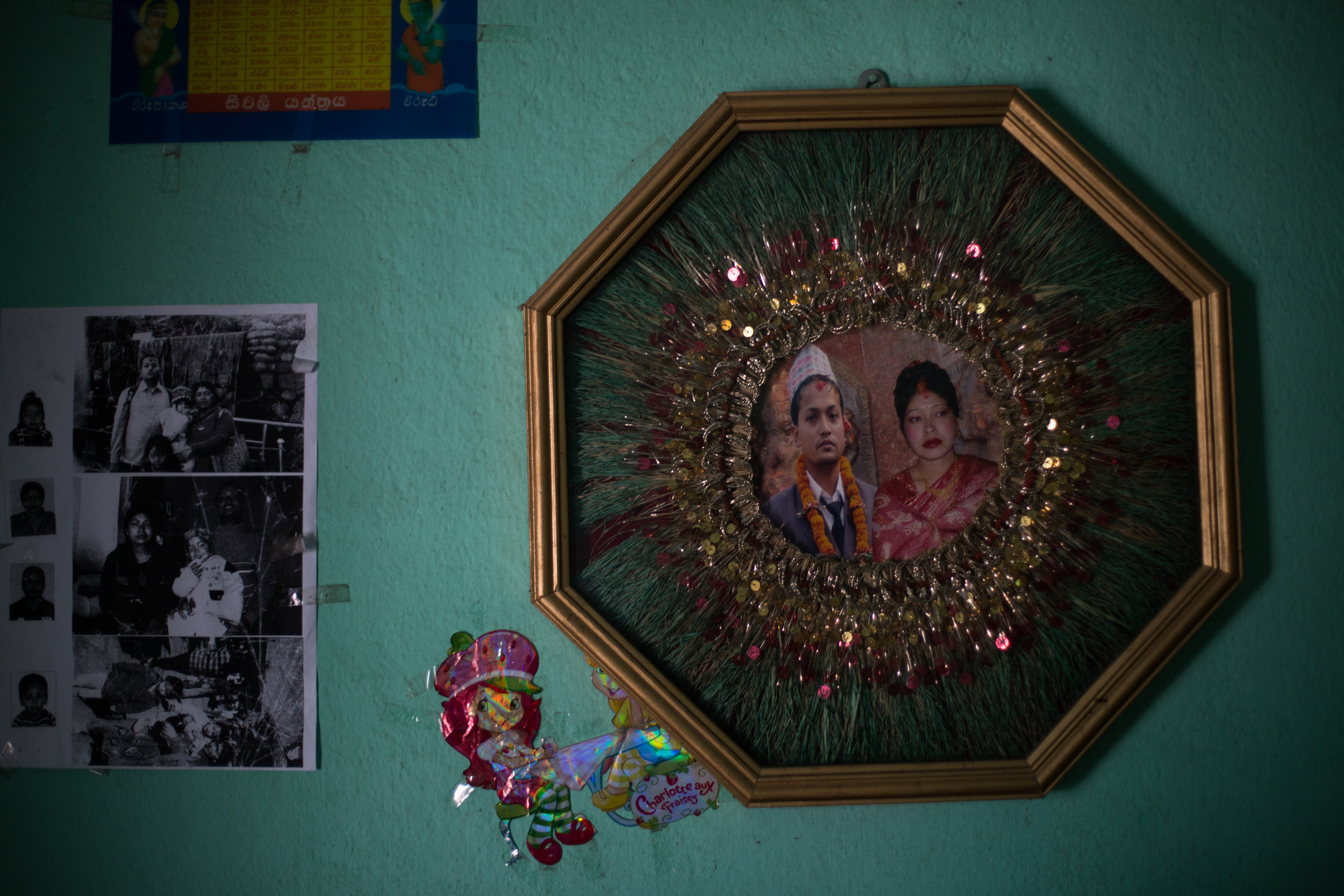 Tirtha and Uma’s wedding photo in their home in Kirtipur is actually two separate photos taped together.