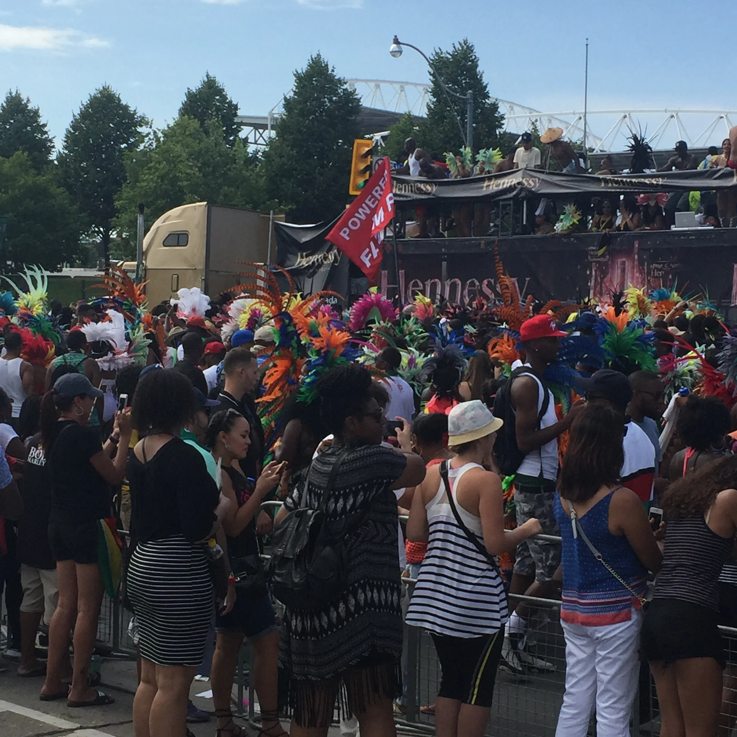 A mixture of people and costumes partying around the moving party truck! 