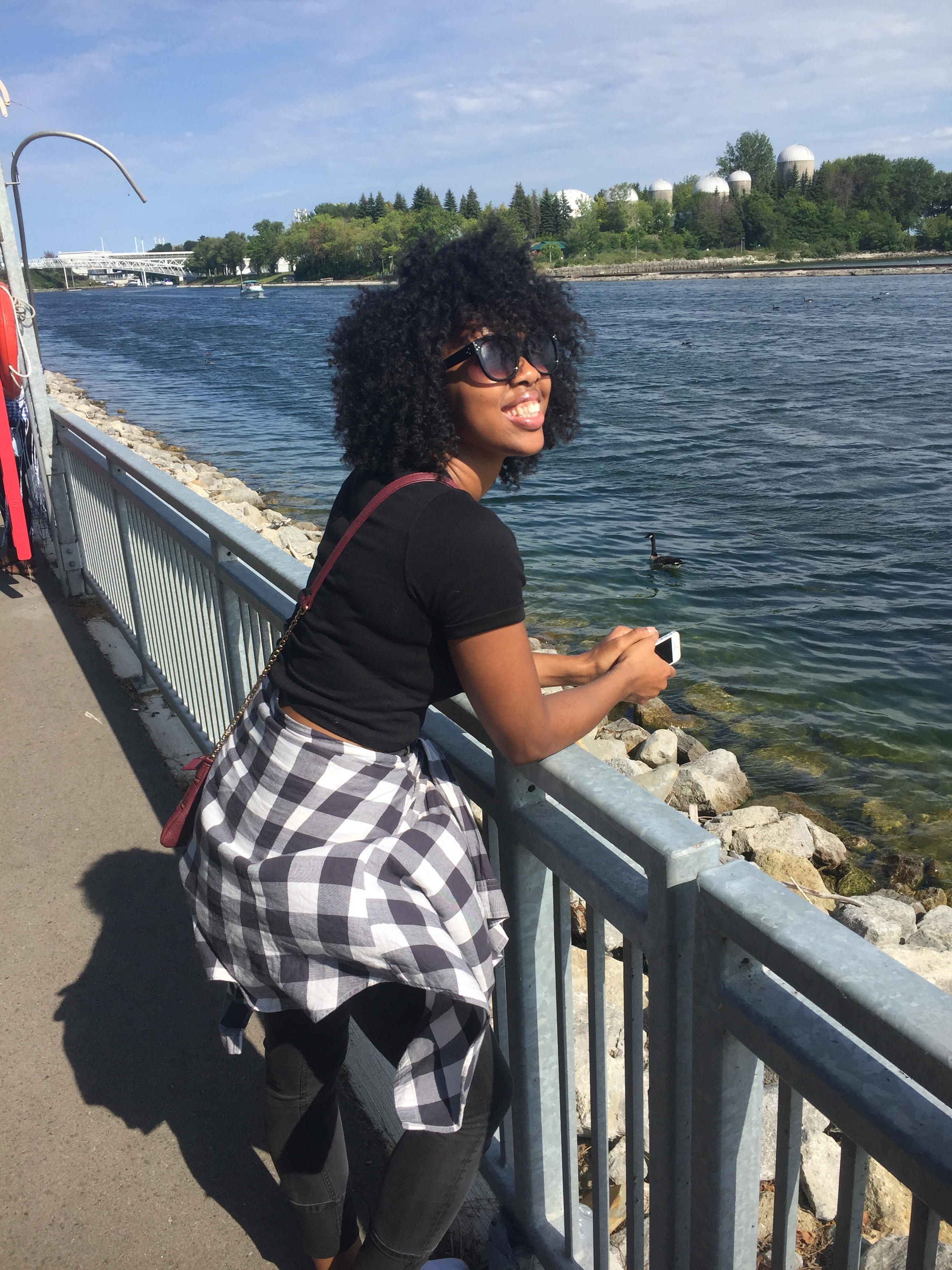 Kesia cooling off near the water, away from the heat of the crowds and foods.