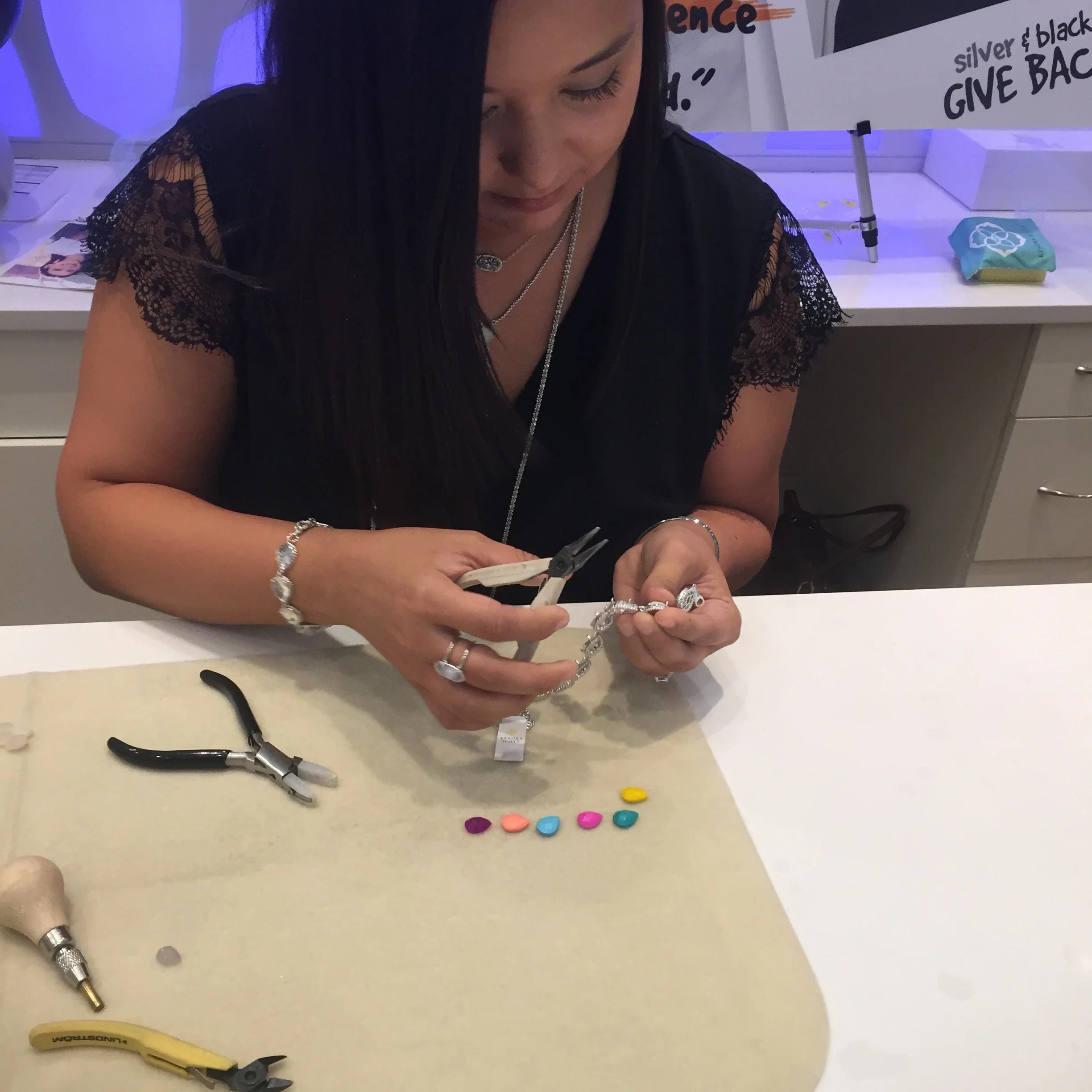 Assembling the bracelet, one stone at a time.