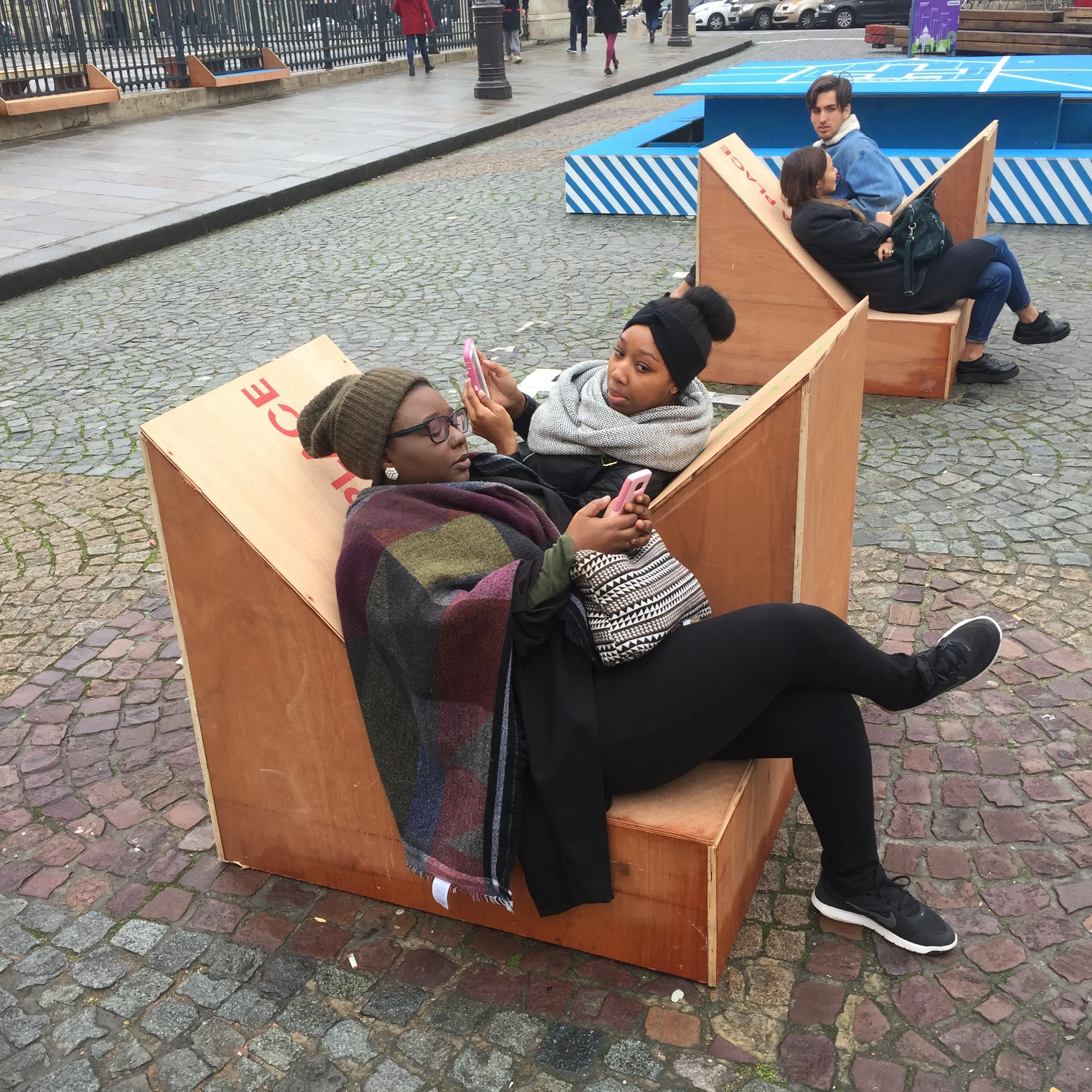 Just updating their snapchat stories on these funky seats across from the Pantheon.