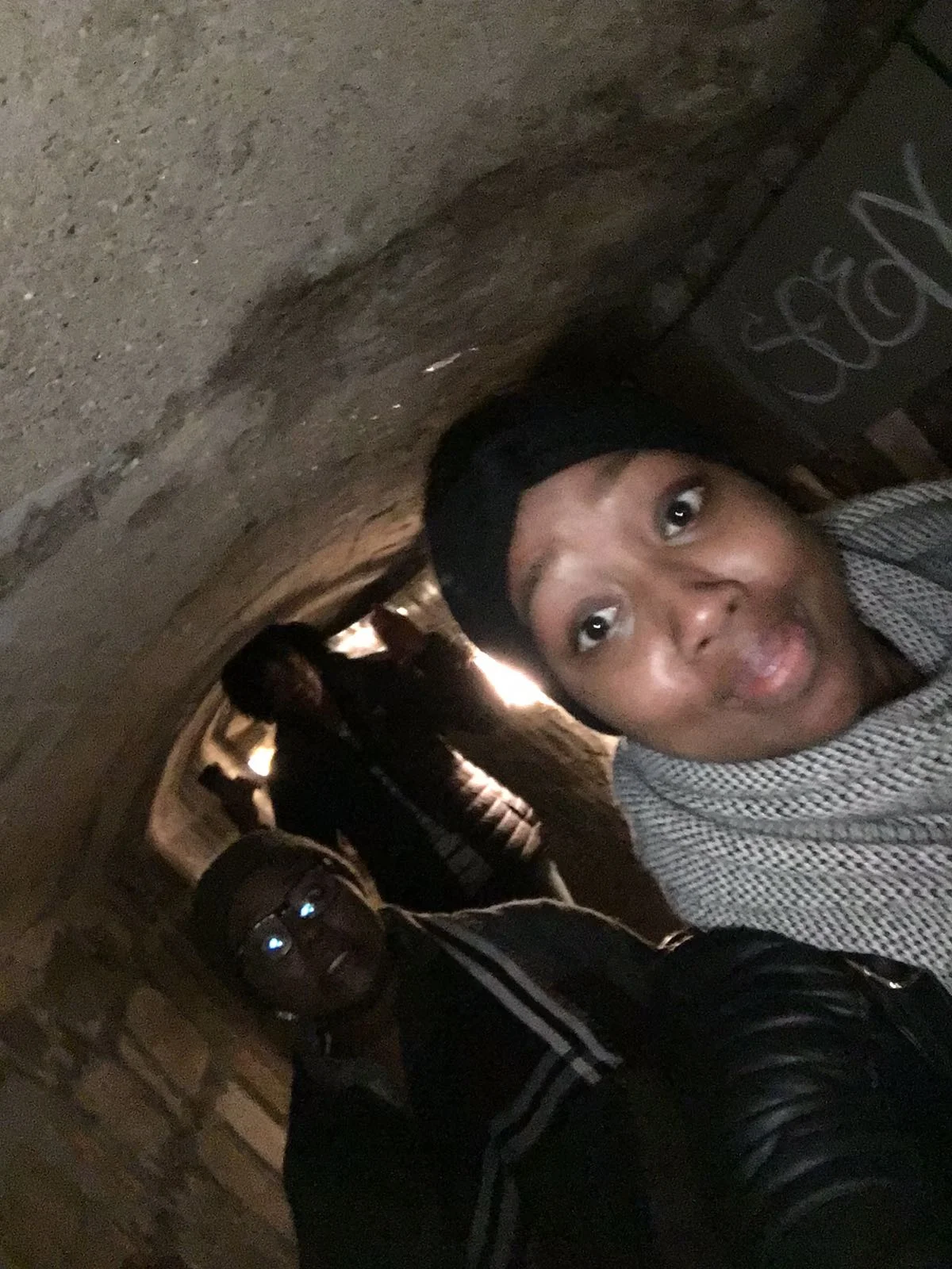 Tall girl problem #346, when you're exploring the Paris Catacombs with your friends, but you don't fit and your head is hitting the ceiling!