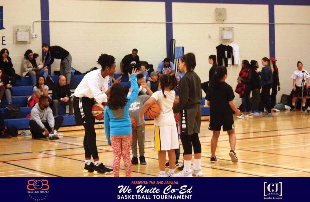 Teaching young girls and boys at the GDIB Box Out Brand Co-Ed basketball tournament.