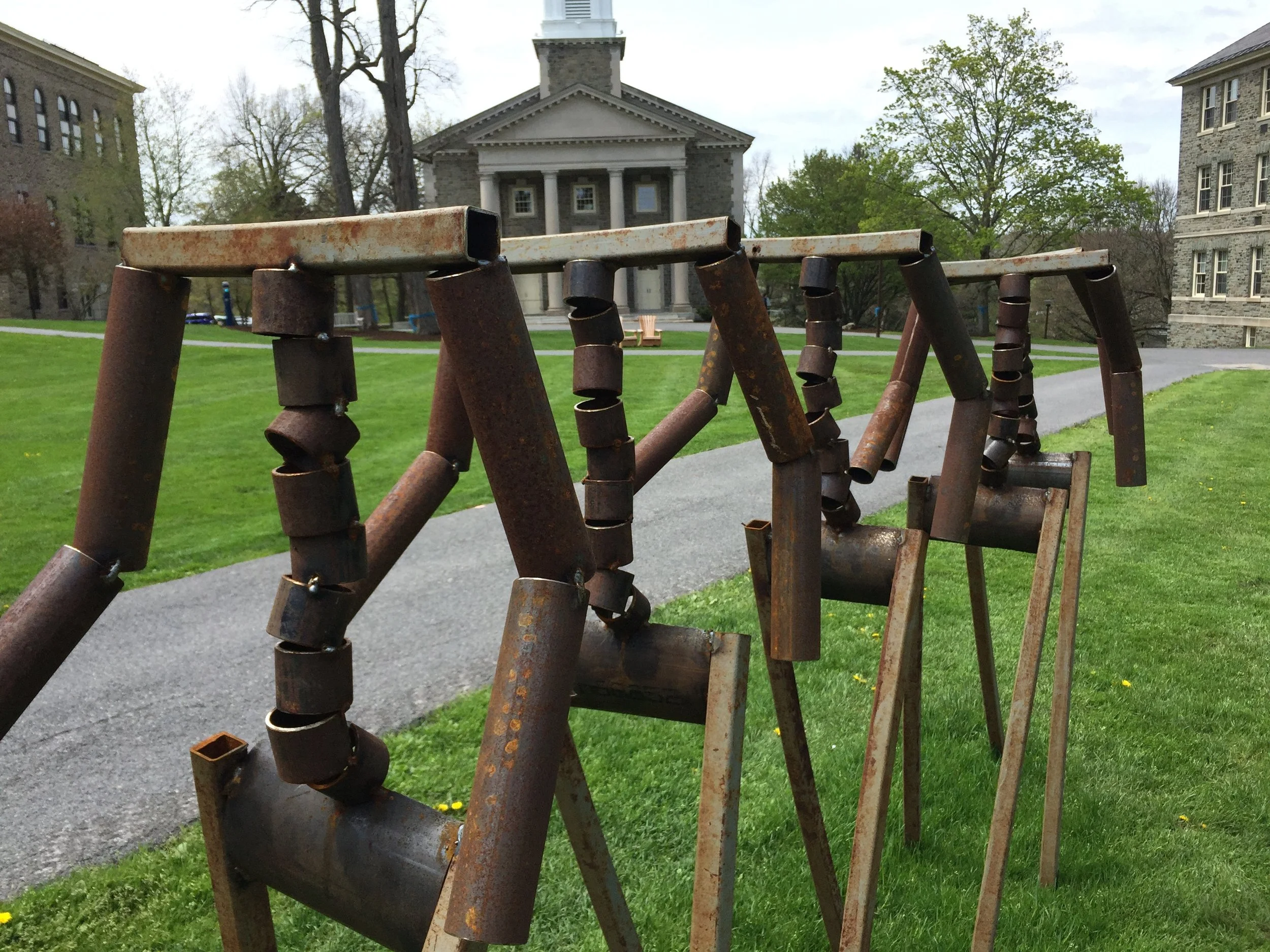  Steel pipe. Each figure about 60" x 15", 40" stride.&nbsp; 