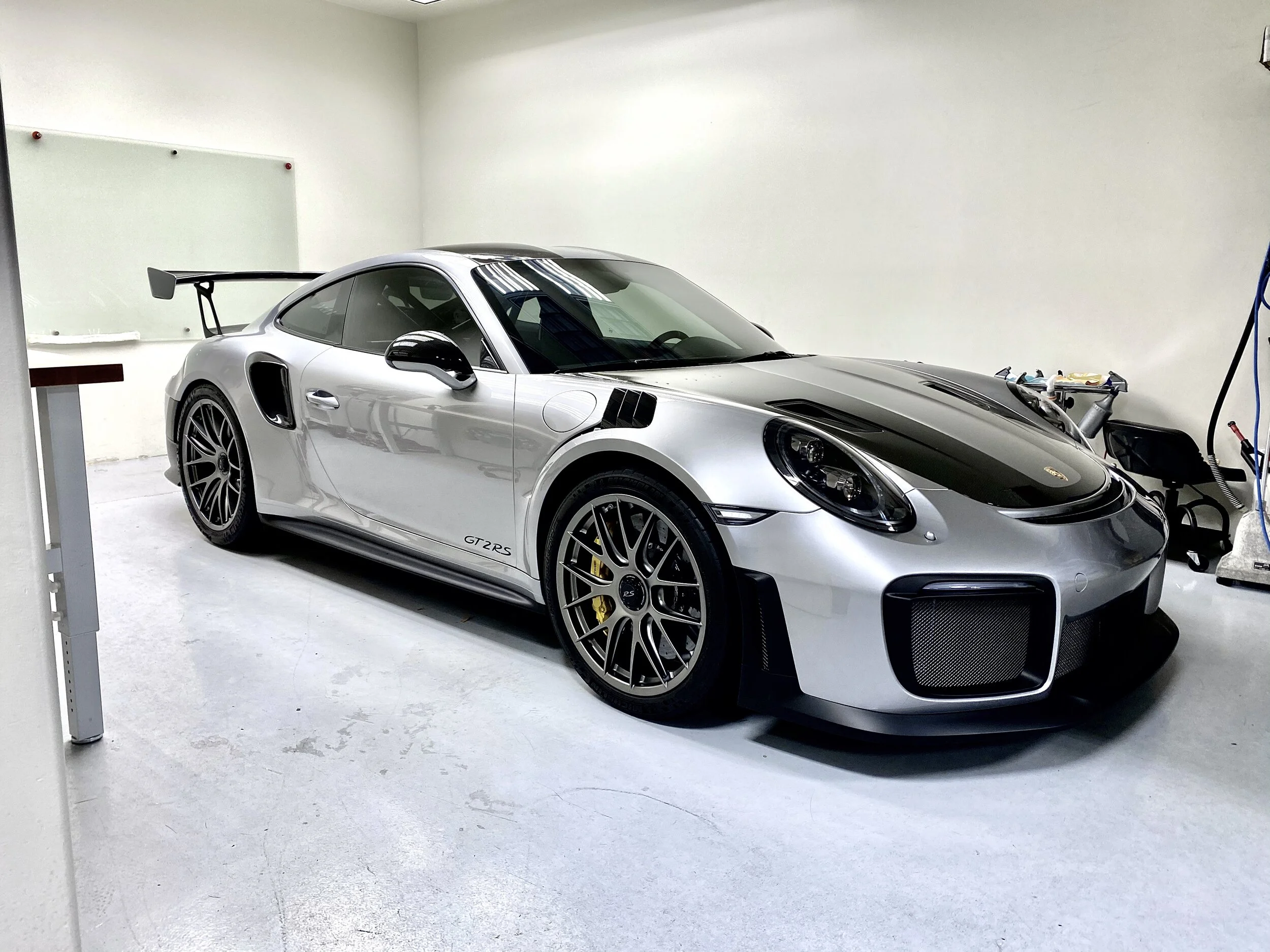 Silver Porsche 911 GT2 RS windshield protection film installed by Danny owner of honest tint and ppf