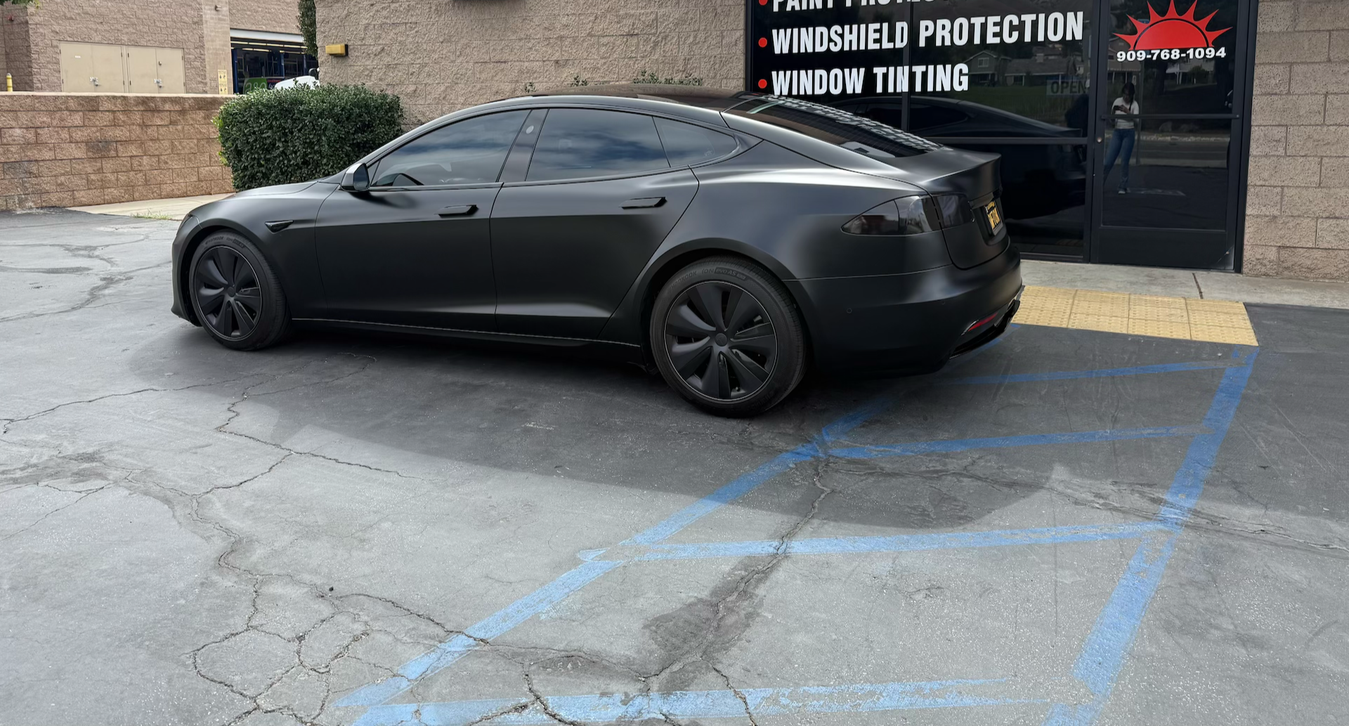 Tesla model S parked in front of Honest Tint after installation of full vehicle protection WITH Autobahn STARKE  paint protection film 