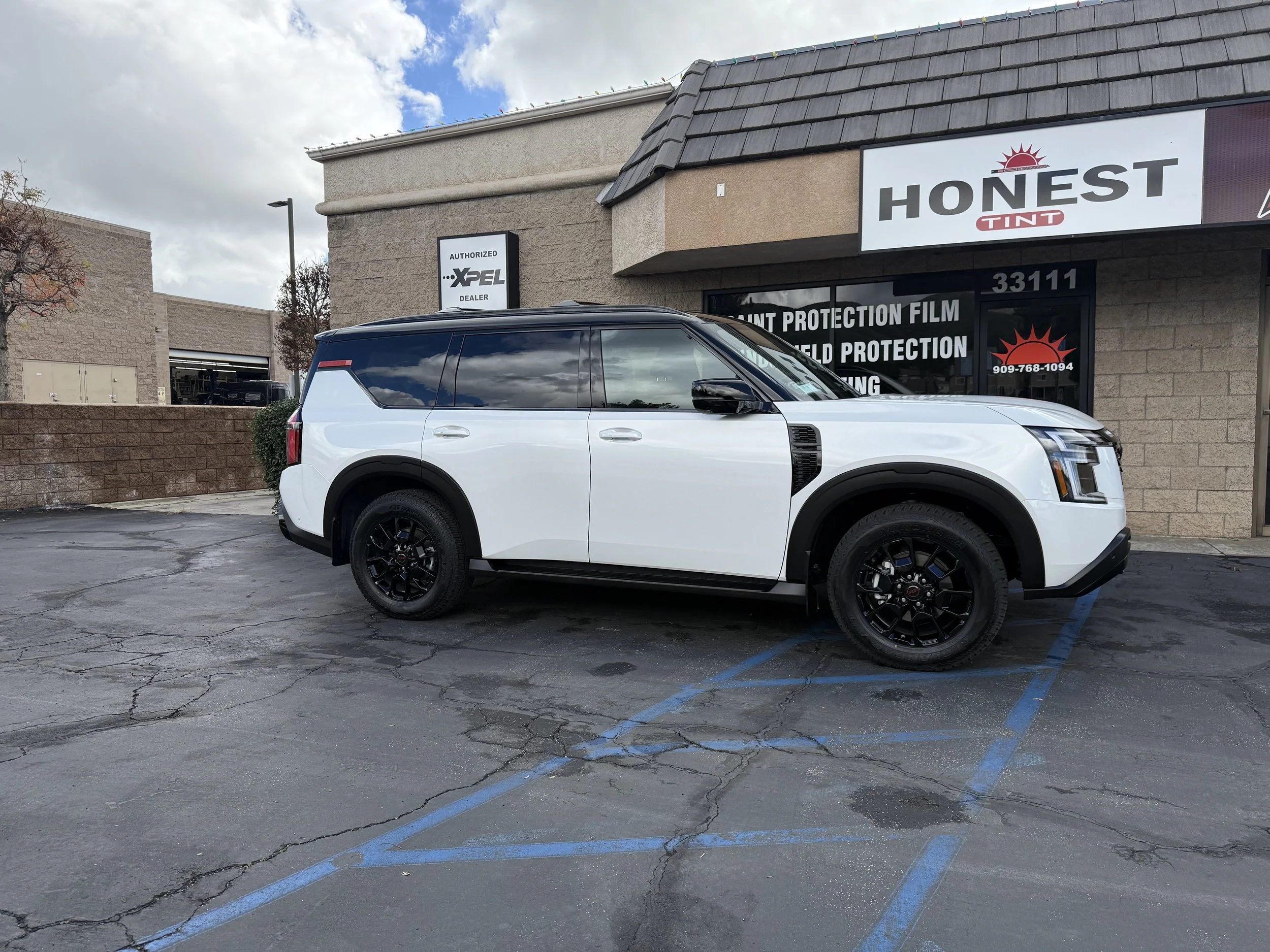 Nissan Armada received the Keep it Tight Package offered exclusively at Honest Tint & Yucaipa Ca. Included is XPEL paint protection film for front end: Hood, Bumper, Fenders, Mirrors, and Headlights. With XPEL Fusion Classic Ceramic Coatings.