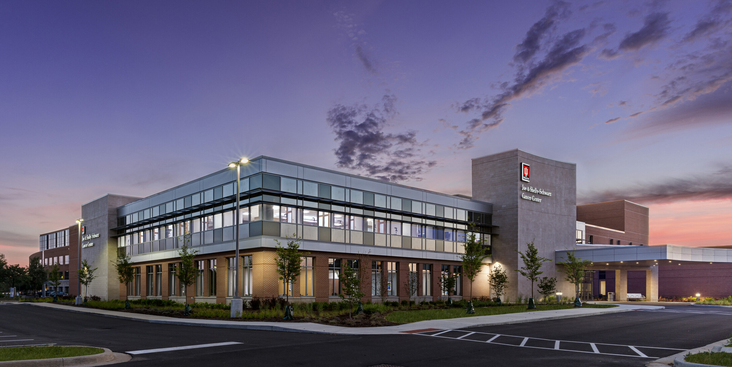 A photo of a sunset sky over a modern building in the Midwest.