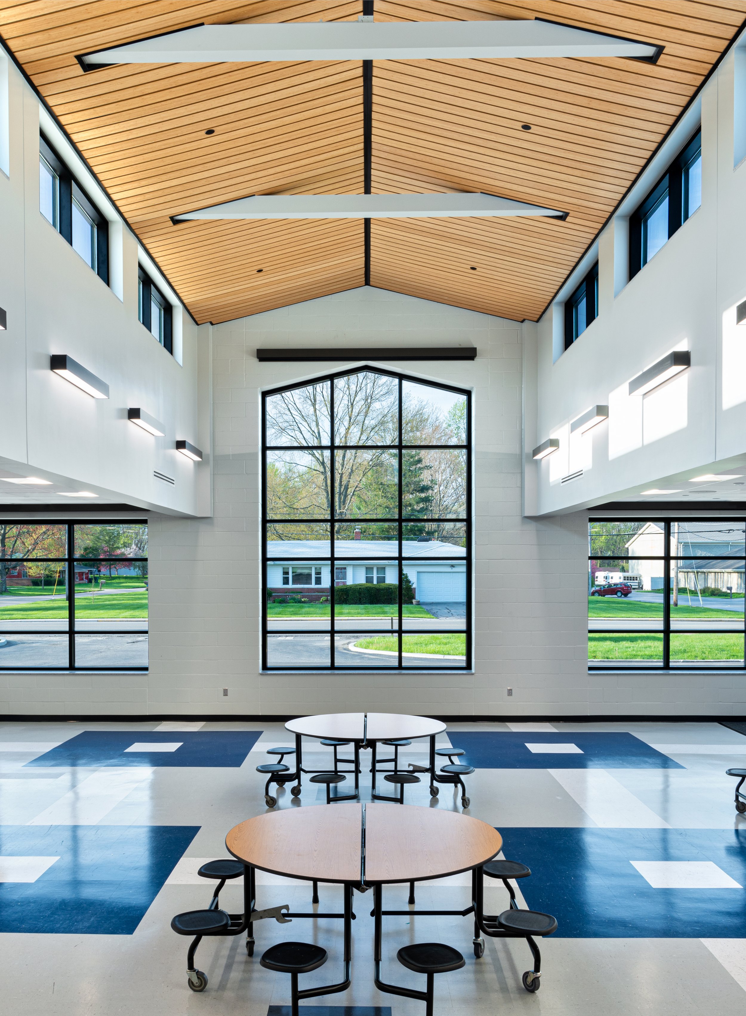 Symmetrical photography of the interior of a school building.