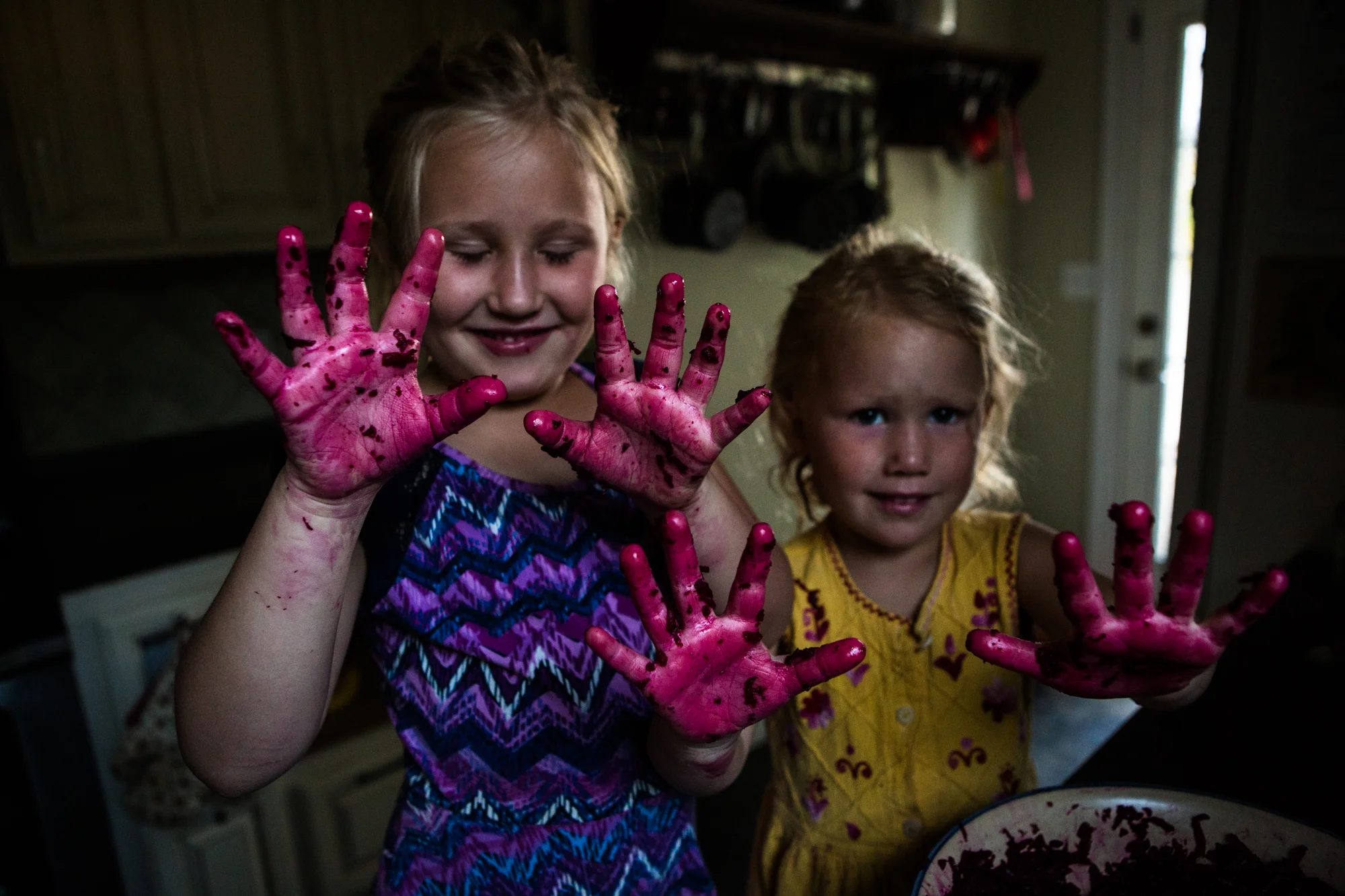 Evelina and Linnaea making a beet hash for breakfast with Lisa.