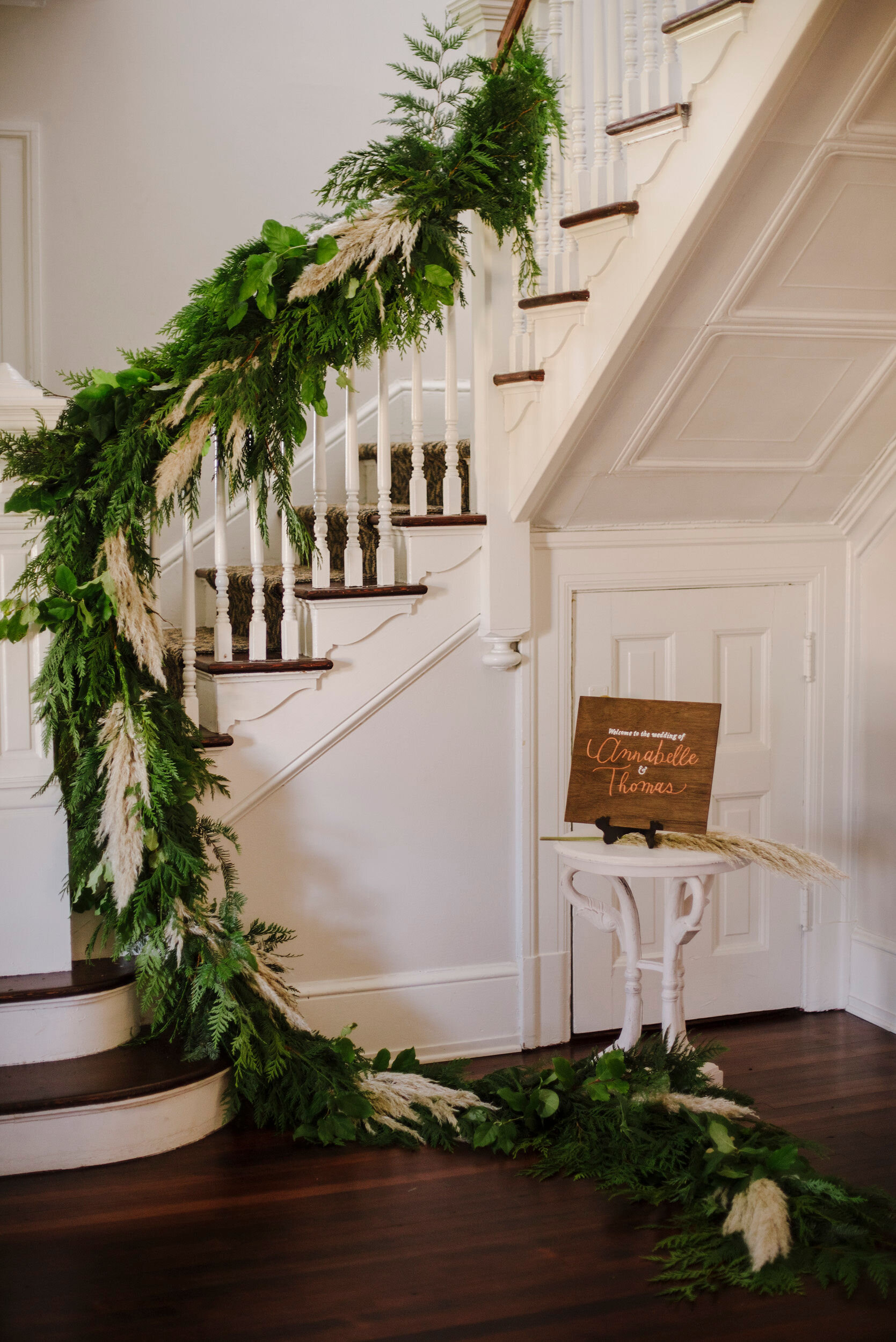 Fort Worden wedding with long stair rail pampas and cedar garland