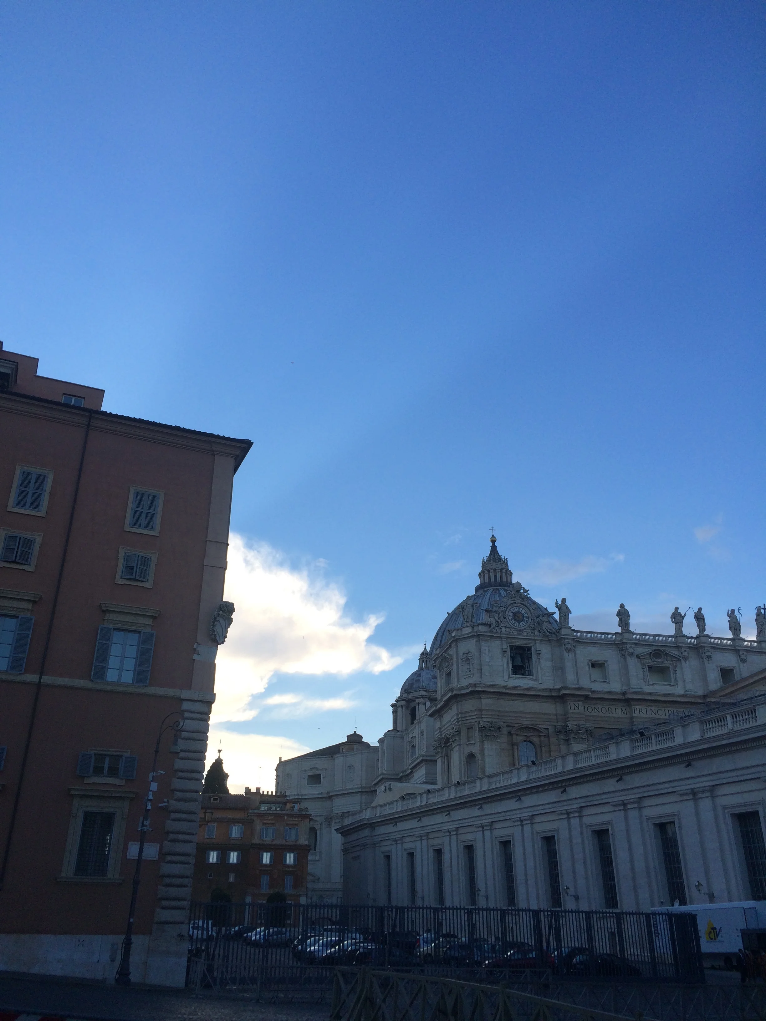 Just outside Vatican City. I liked the rays of light coming from behind the building on the left.