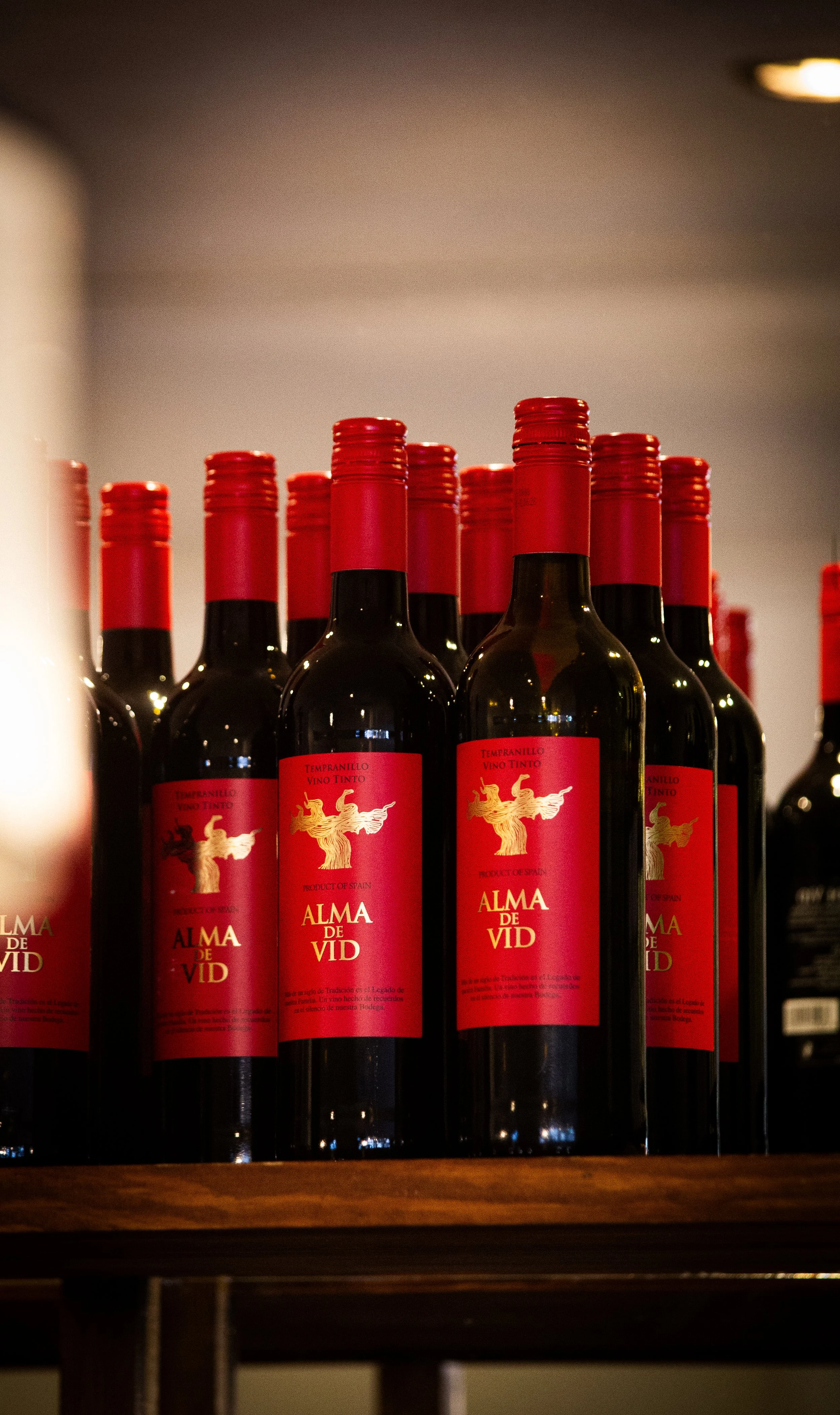 Shelf display of bottles of wine