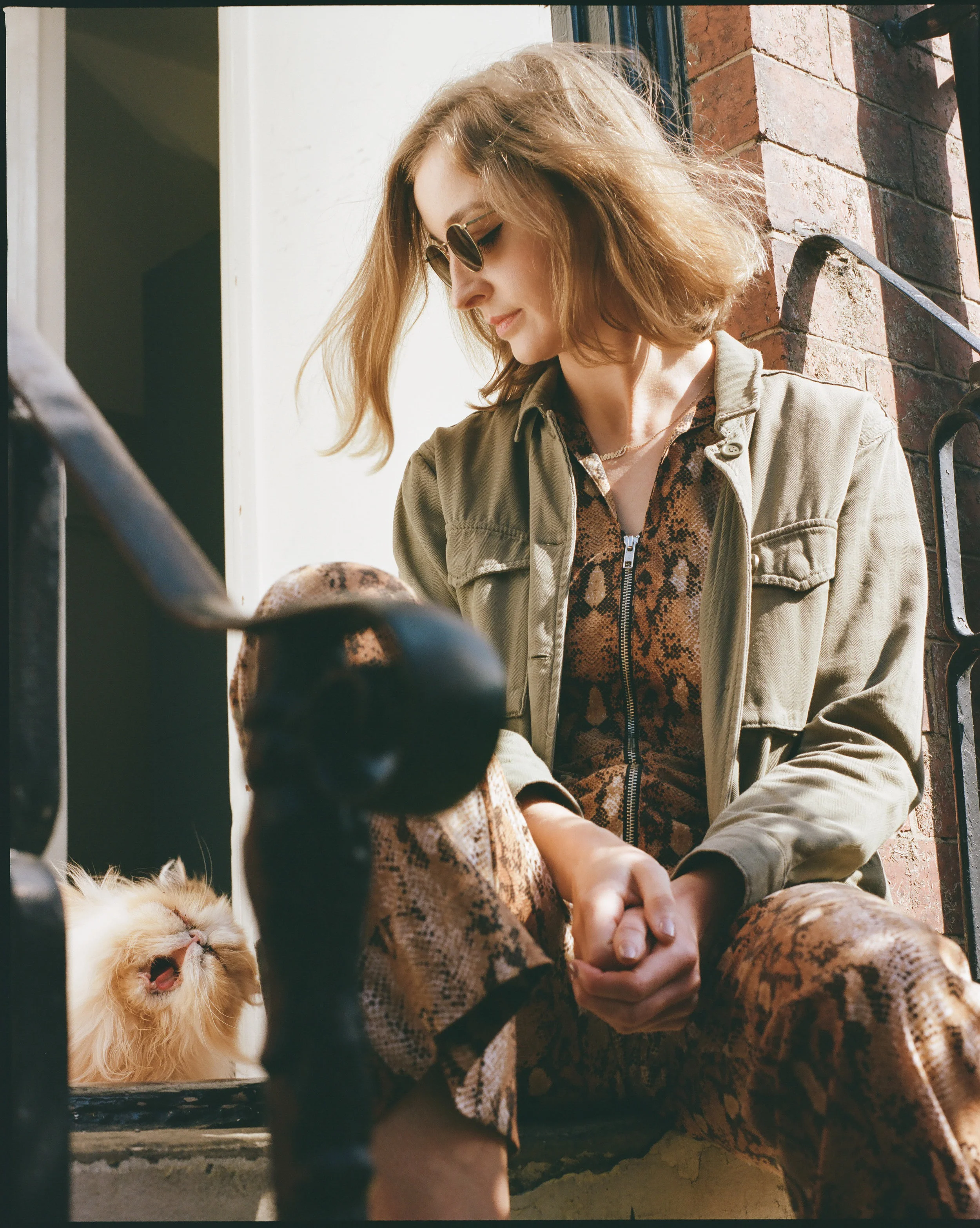 Emma in Neil in Satin Gold with her cat, Lady.