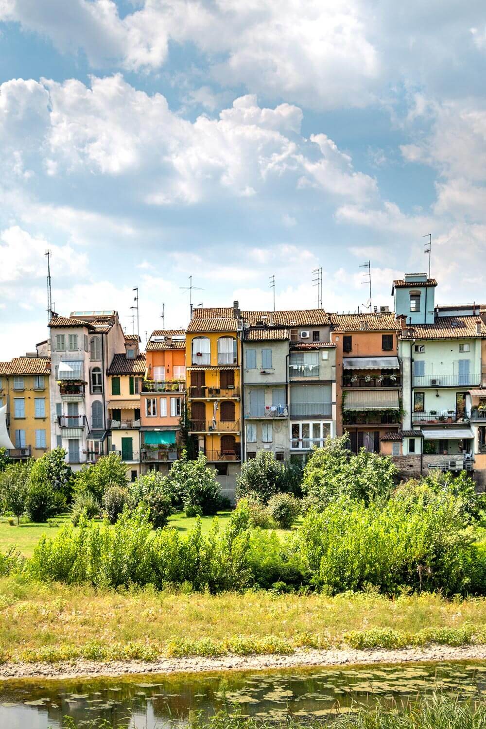 Colorful buildings along the Parma river