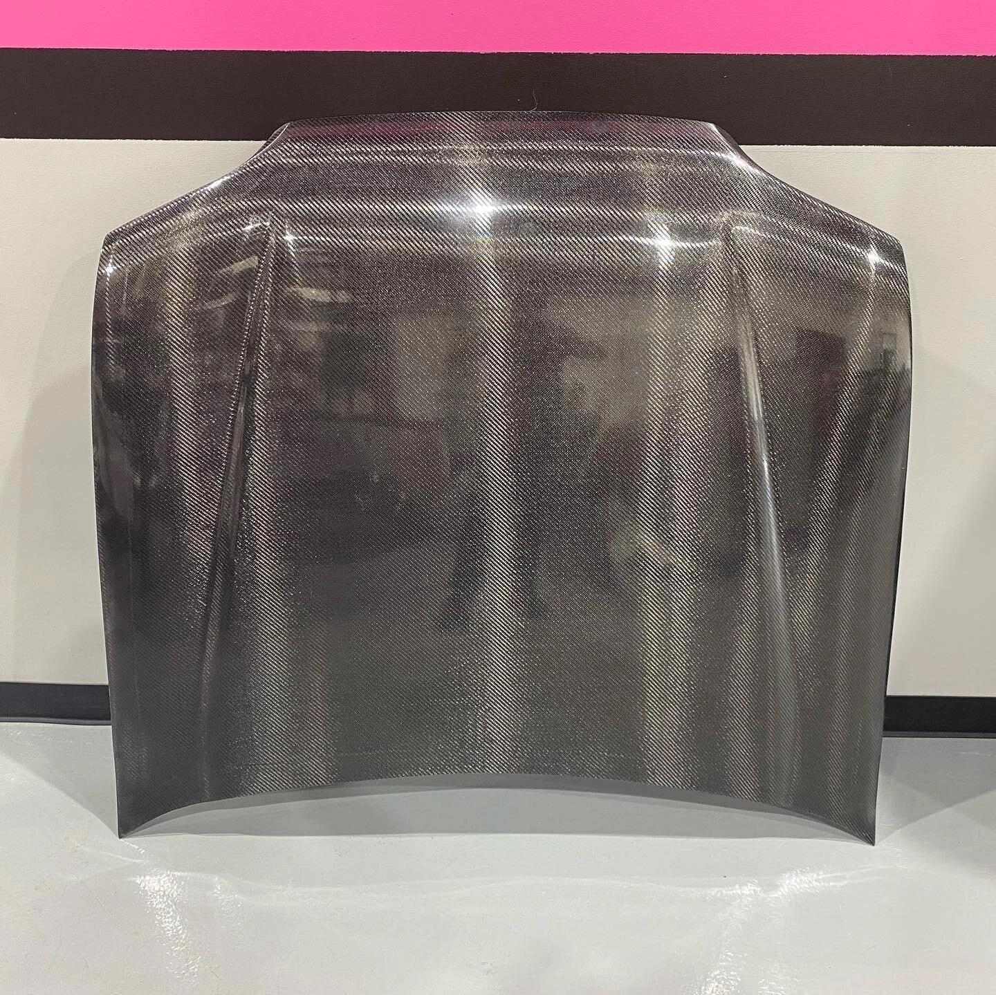 Eg extended pin on race hood. Real deal carbon with honeycomb. 8lbs!! Stiff as can be. No more flexing hoods going down track. This is a pin on hood, which means you can not use hinges. It goes all the way to the windshield for the best aero we can o