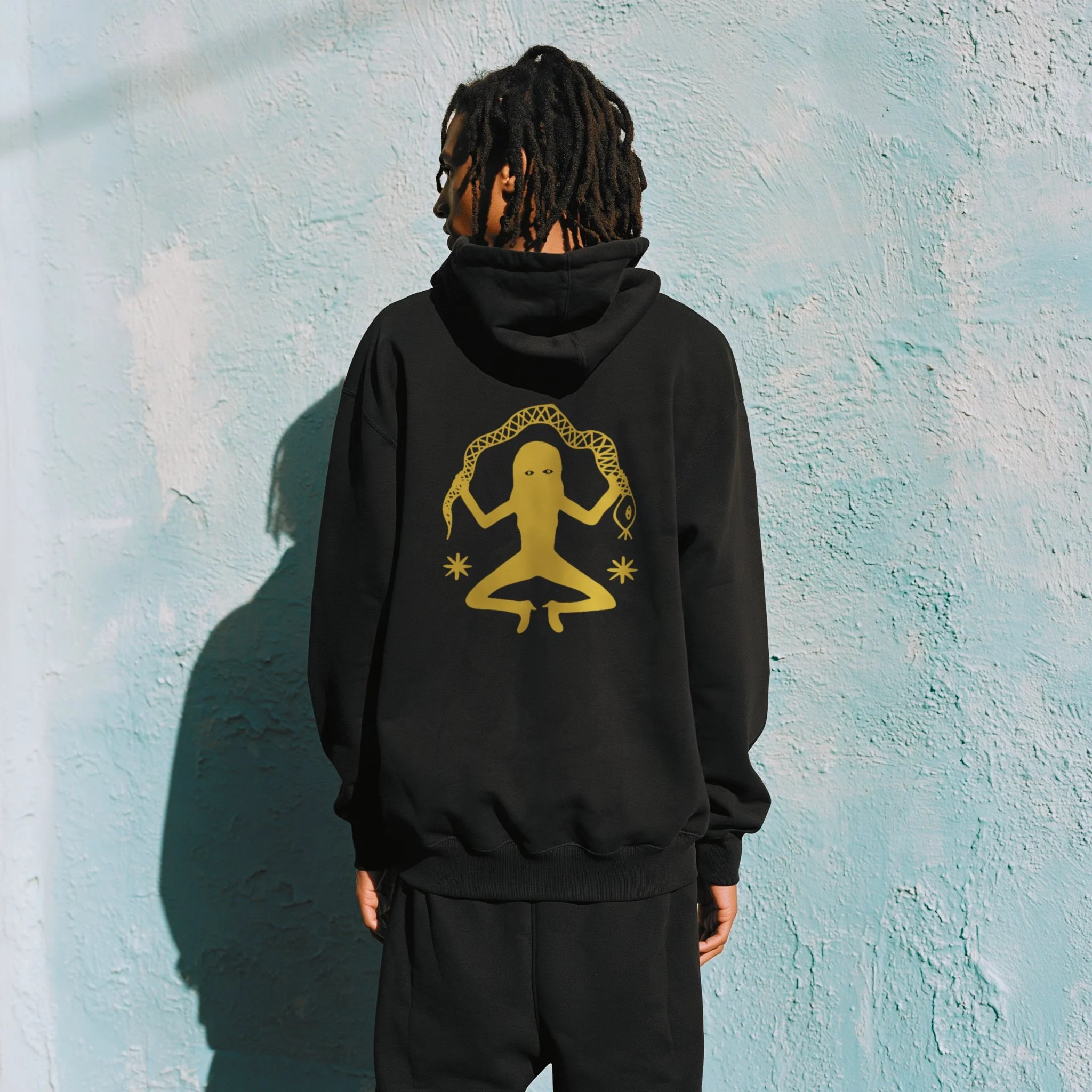 16PN Serpent Meditation hoodie, gold meditating figure holding snake on black