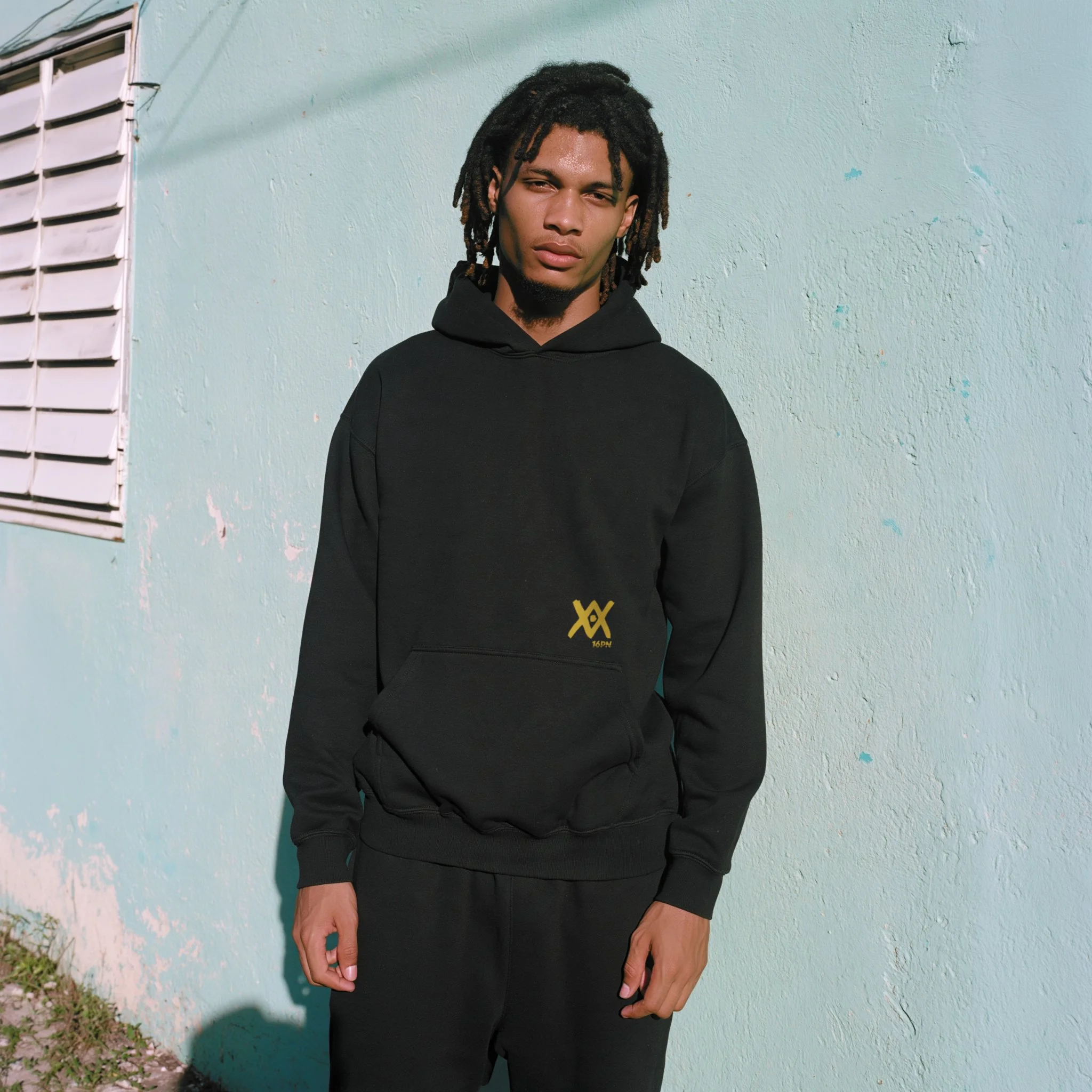16PN Serpent Meditation hoodie, gold meditating figure holding snake on black