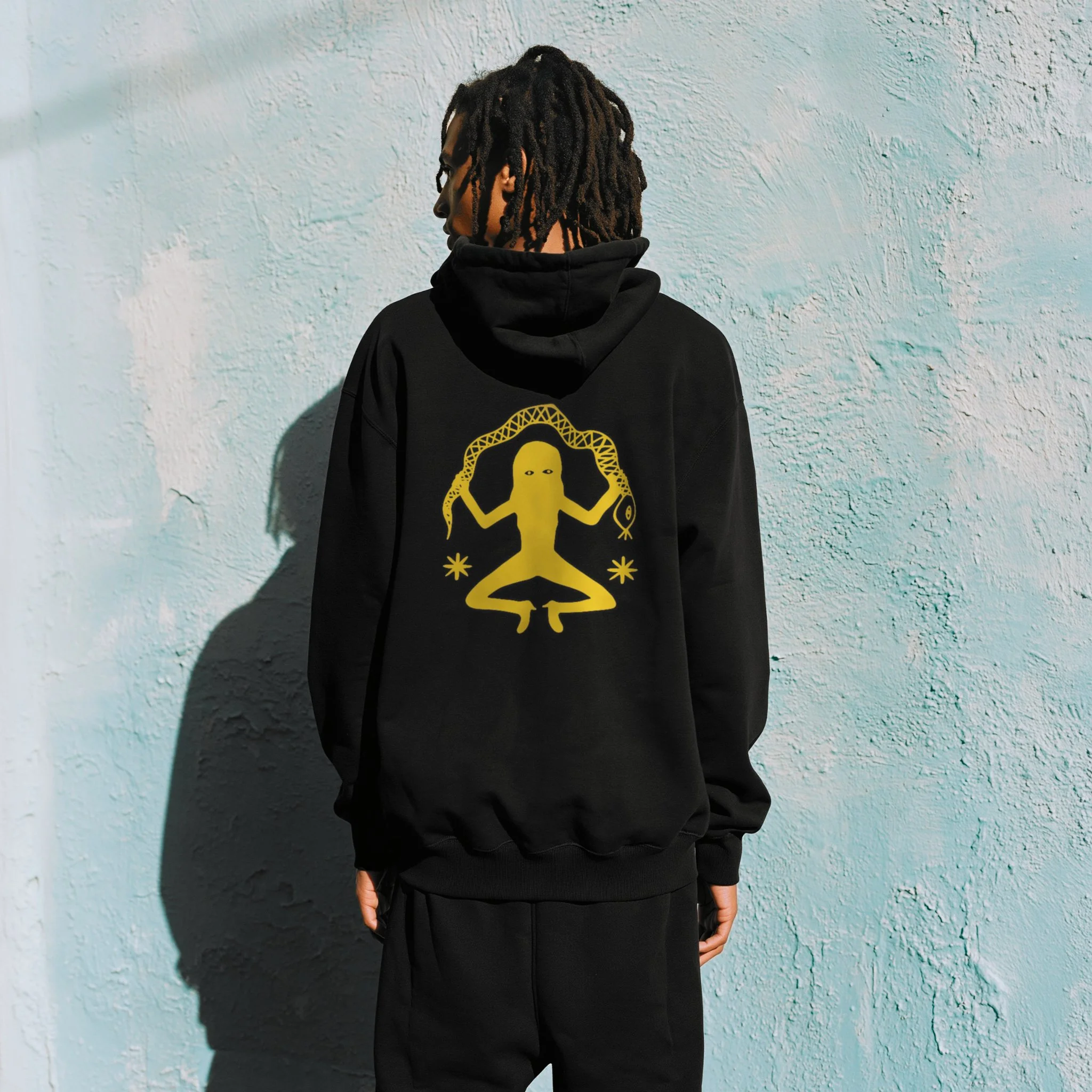 16PN Serpent Meditation hoodie, gold meditating figure holding snake on black