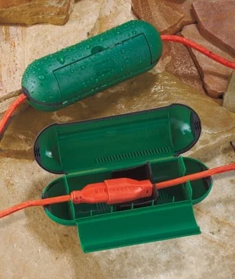 This clever device protects the juncture where the extension cord meets the main cable.