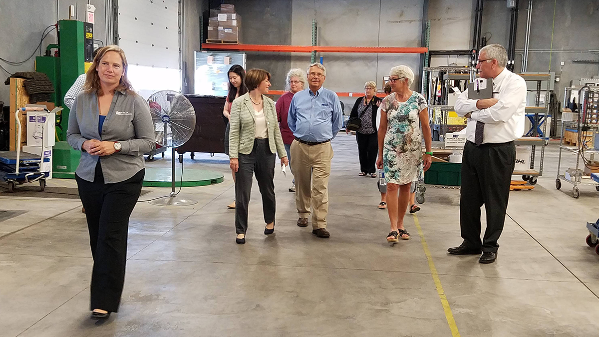 Chantill Kahler Royer leads the tour group to the next station.