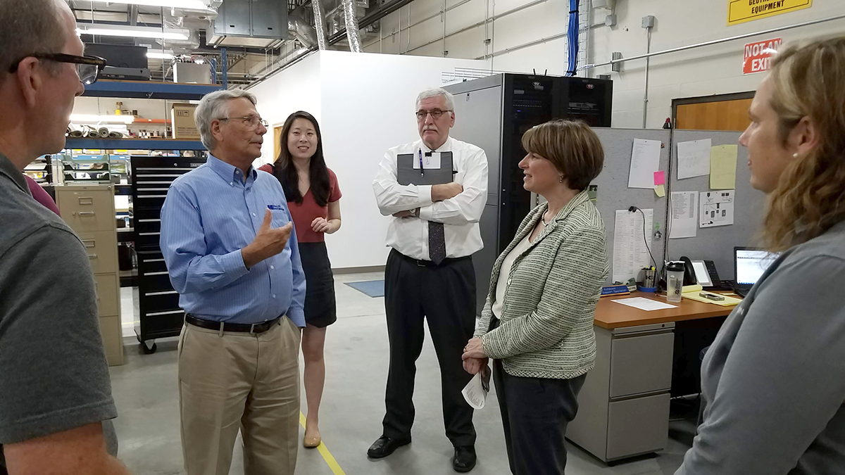 Wayne Kahler talks to Sen. Klobuchar about the role of aircraft, and rural airport infrastructure, in Kahler Automation’s business model.