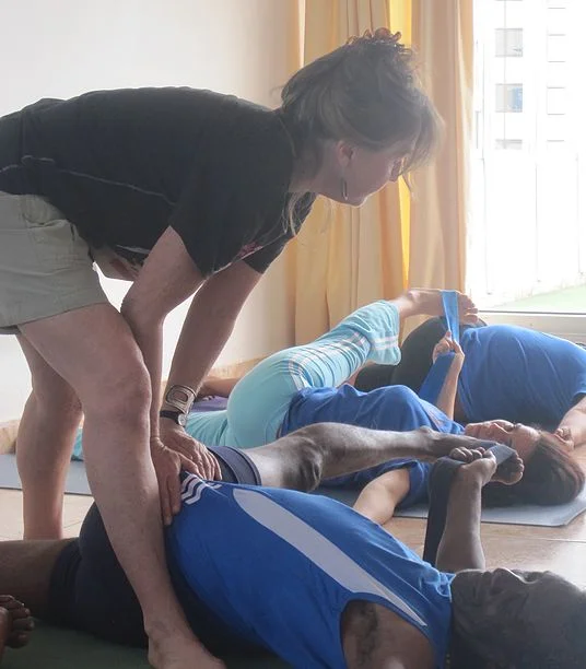 Mary Paffard Adjusting students in yoga — Holguin and Habana 2014