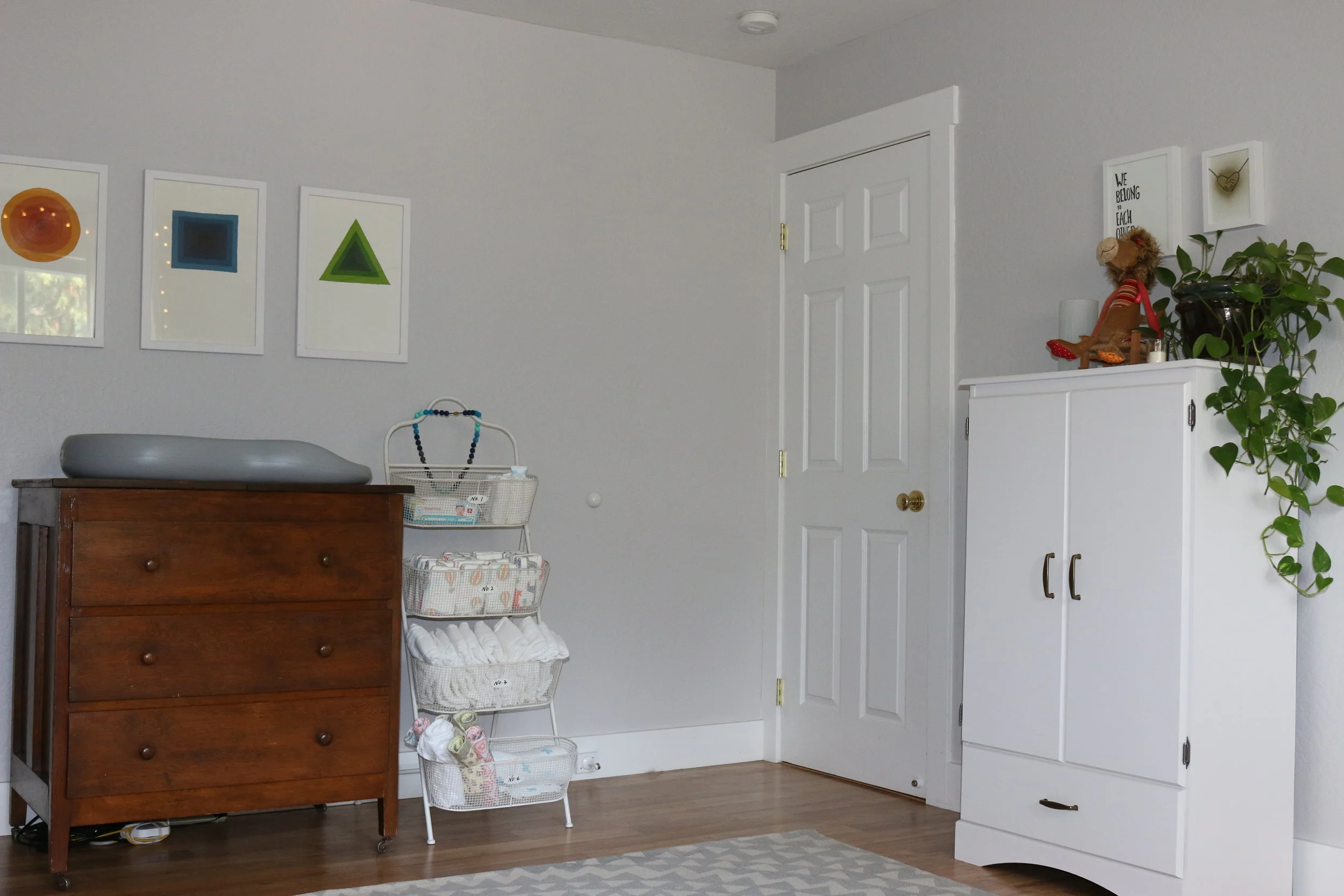  The white armoire is from a garage sale and was repainted, the art above the armoire is from www.jaybryantjones.com who happens to be Daddy.