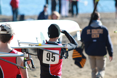 Carrying boat to launch at the Blake Haxton Regatta