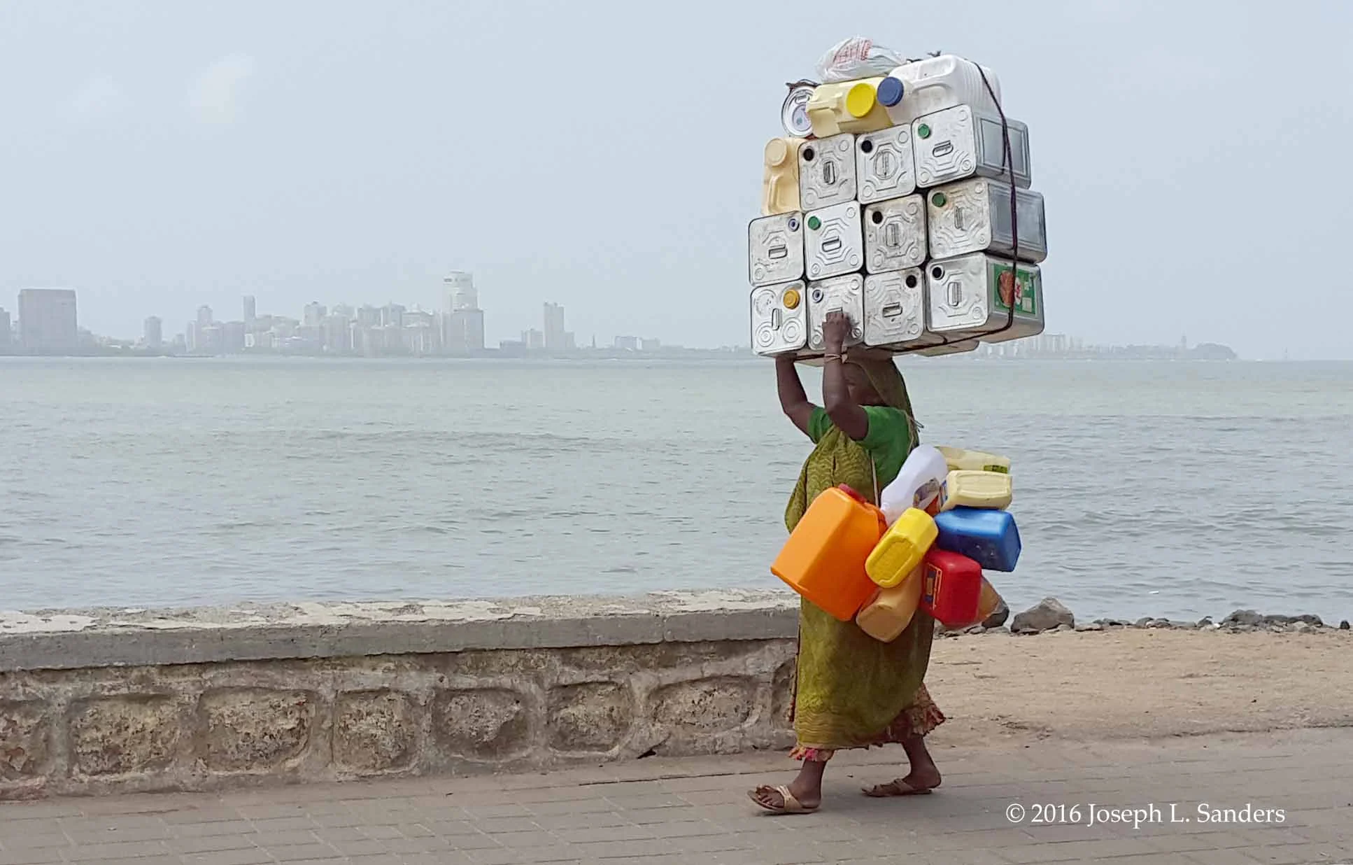 Woman Carrying Cans - Chowpatty - Mumbai16.jpg
