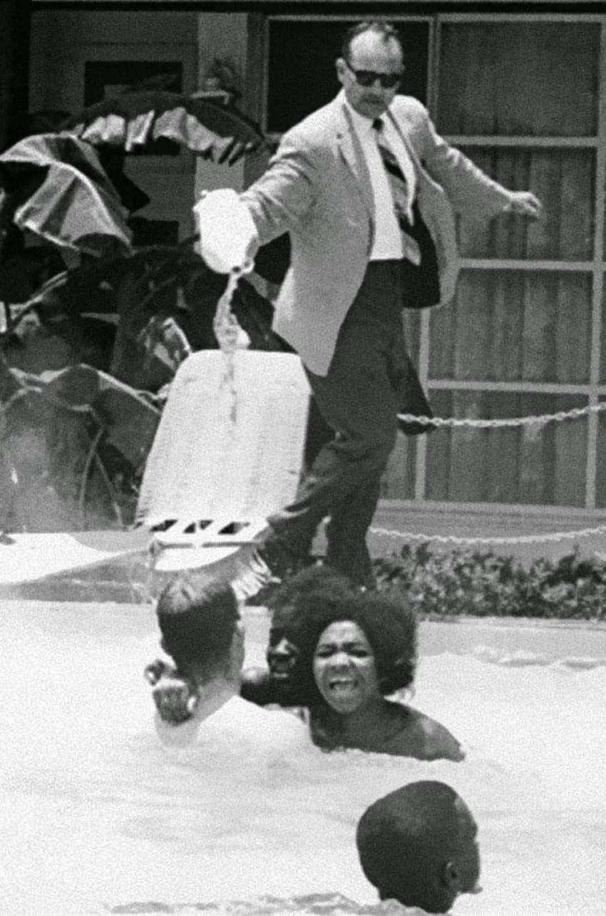 Motel manager pouring acid in the water when black people swam in his pool, 