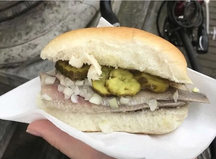 Herring Sandwich | Amsterdam, Netherlands The Dutch national dish has Herring with pickles and onions on a bun. Tastes like a cold meat sandwich and it’s a simple recipe.
