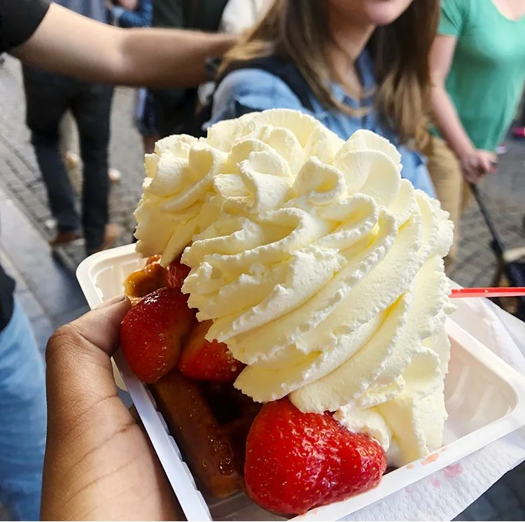 Belgium Waffle | Brussels, Belgium Sweet Belgium waffle, you can add whatever toping suites you. The locals just eat the waffle with a little sugar on top. Tourist typically go all out with whip cream, strawberries and other toppings, which could be seen as offensive.