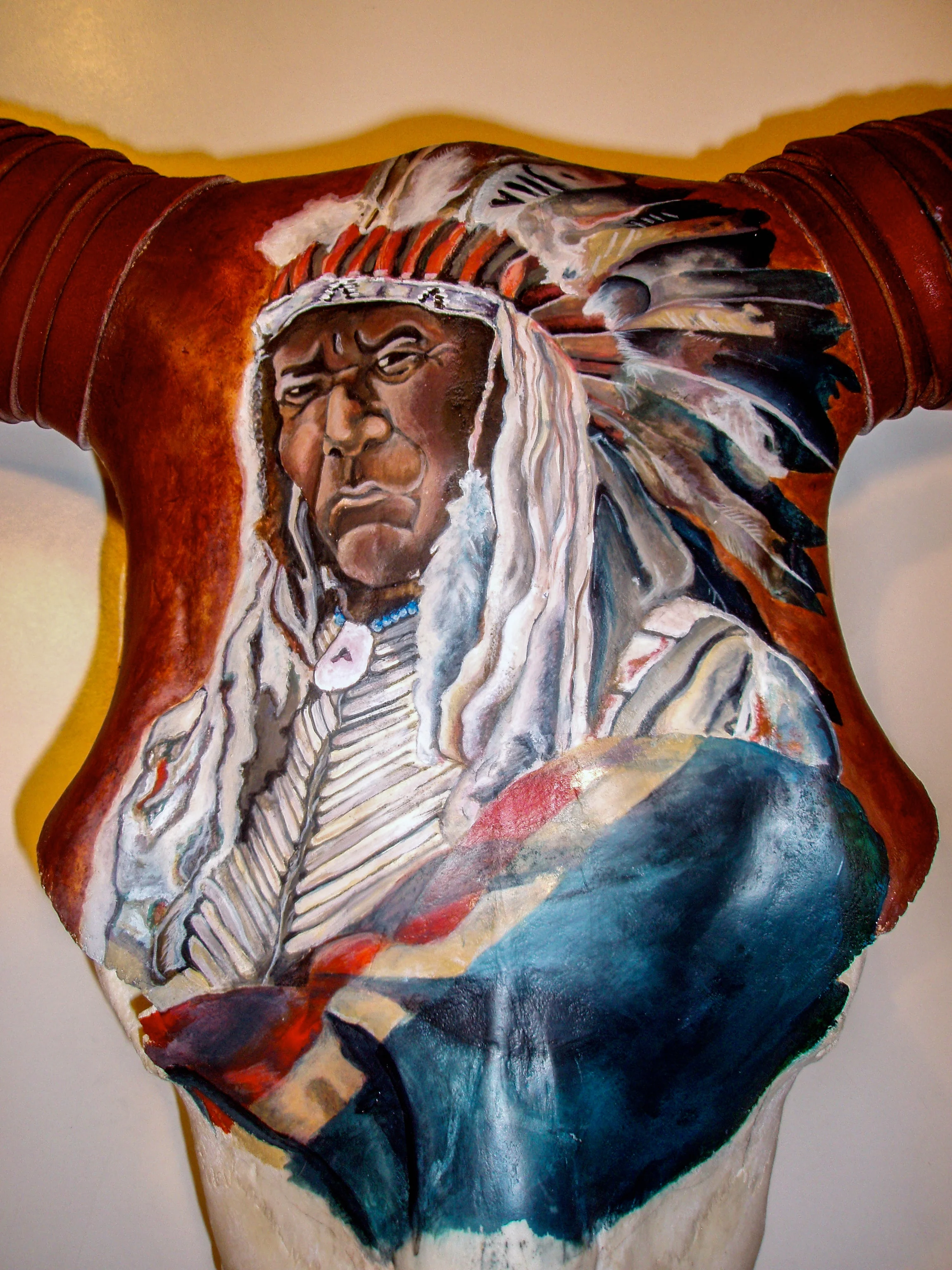 indian on longhorn bull skull