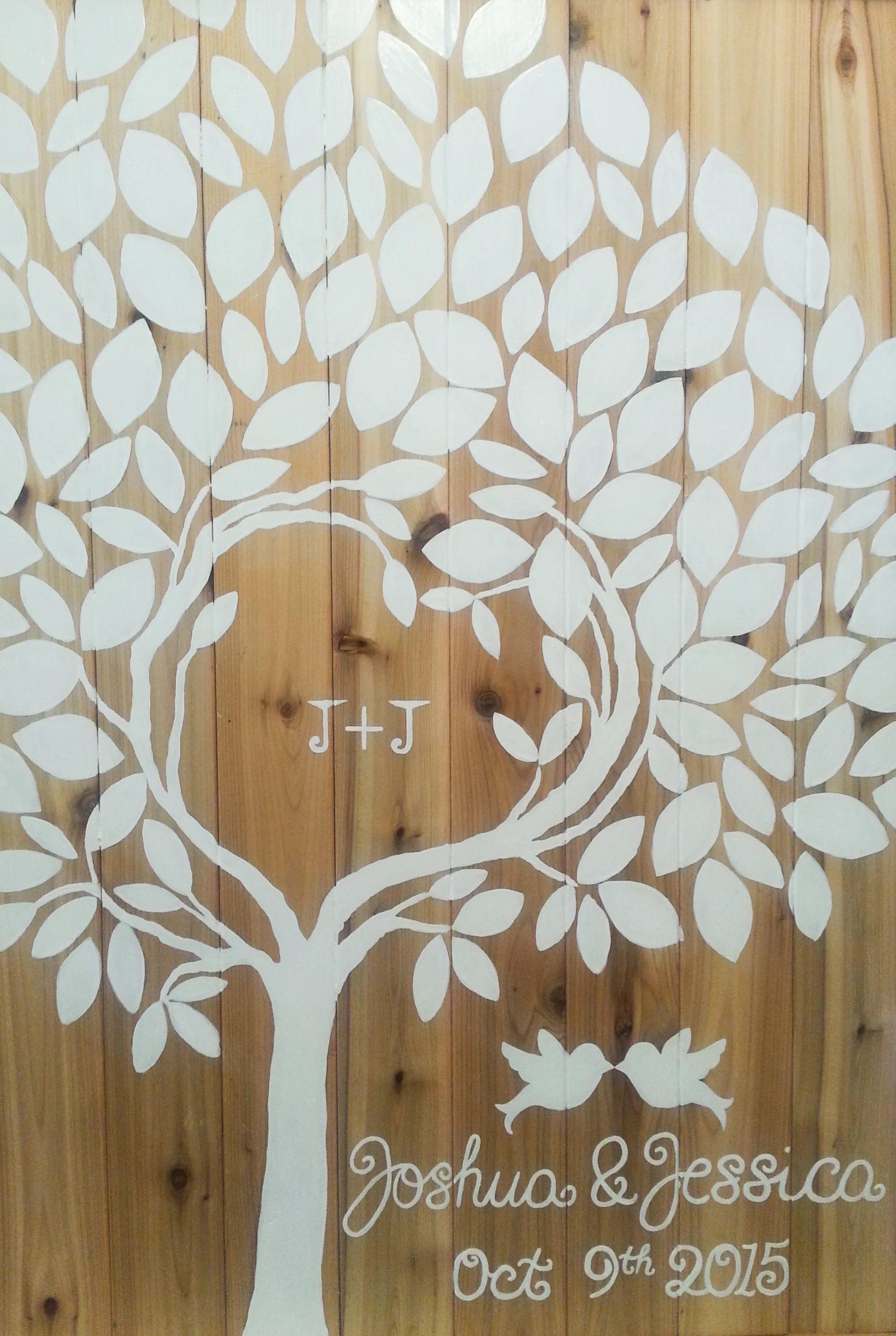 guests sign the tree leafs