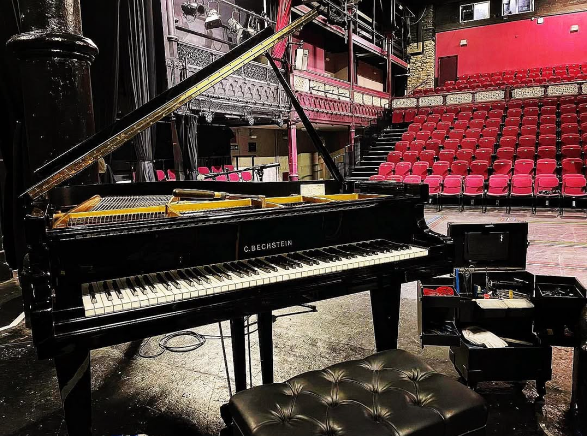 Bechstein grand piano set up on a stage