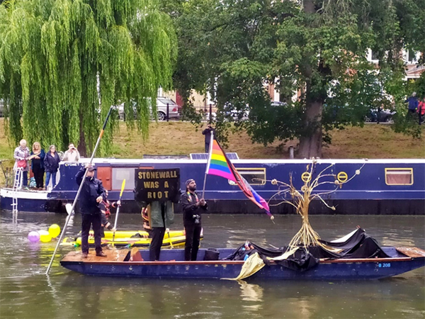 'Stonewall was a riot' banner at Cambridge Pride (UK) in June 2019: Remembering the shifting rights to 'ownership' of spaces such as Stonewall Inn (the New York gay bar, the police raids of which led to the opposition from queer community in 1969 and to the first ever Pride marches), as well as 'ownership of oneself' particularly stark in case of activists of colour given the lack of freedom their communities have suffered. (Photographed by Marcin Smietana)