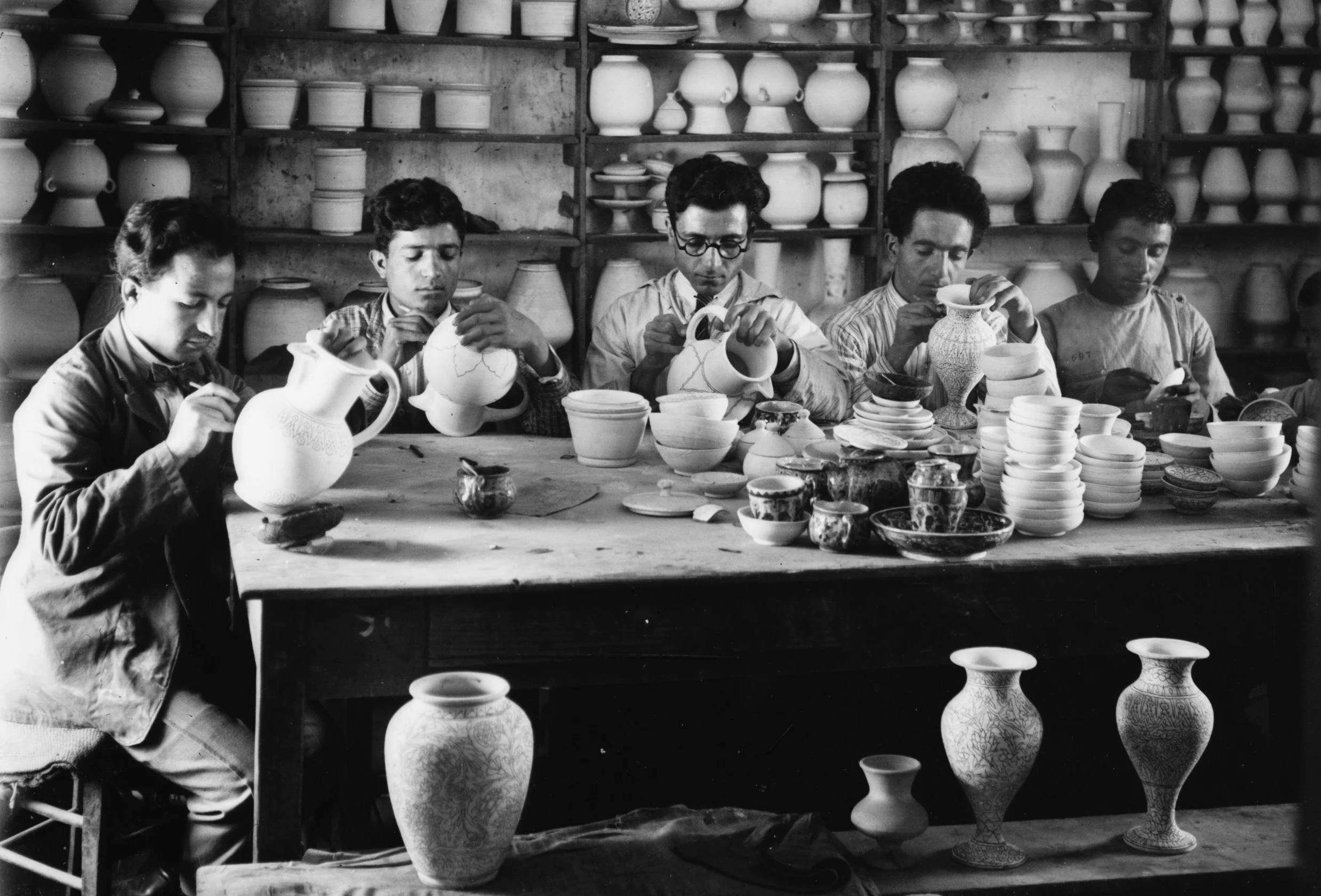 Young men drawing designs on pottery, c. 1922. (Library of Congress, Matson Collection)