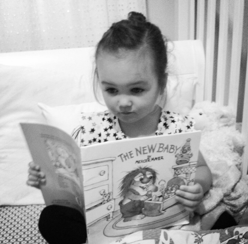 Here's a picture from a few years ago. You loved reading by yourself before you could even read. It's not surprising – both of your parents are serious readers. The thing I remember most about your mom from when we were little were the stacks of books she left all over the house, in all of the bathrooms. Your mind is beautiful—keep filling it with whatever interests you.