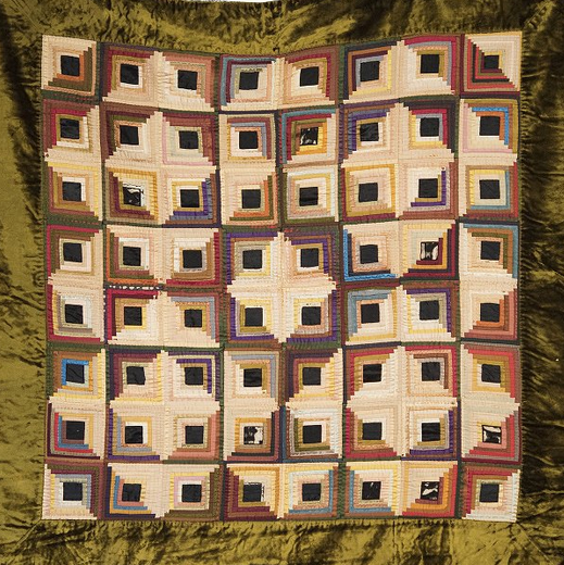  Vibrantly-colored quilt employing optical illusion patterns 
