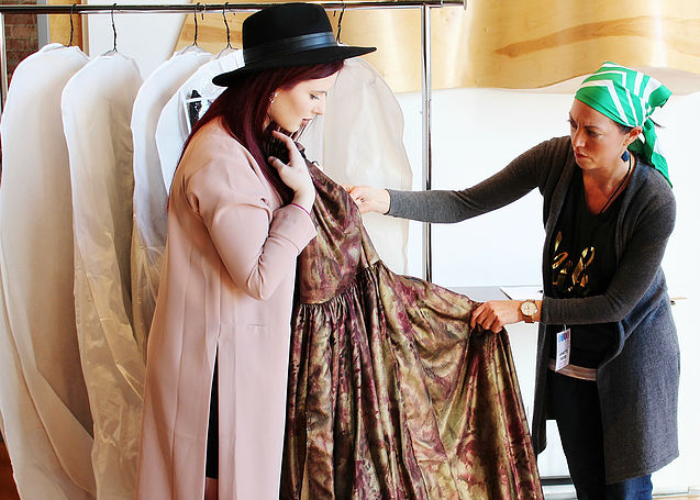 Designer Kiana Godsey shows her collection during rack check to Director of Production, Annette Pinter . 