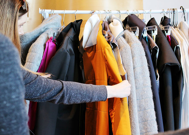  President, Teisha Barber looks through a collection for review during rack check