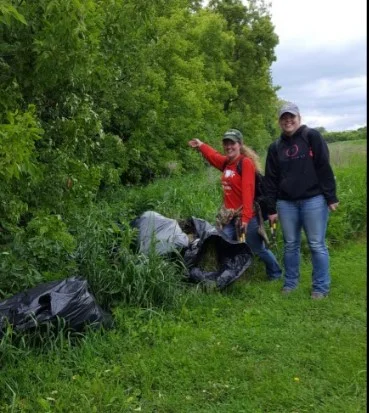 In May 2017, the interns removed nearly a dozen large garbage bags full of garlic mustard, an invasive noxious weed, from a tree line on site.
